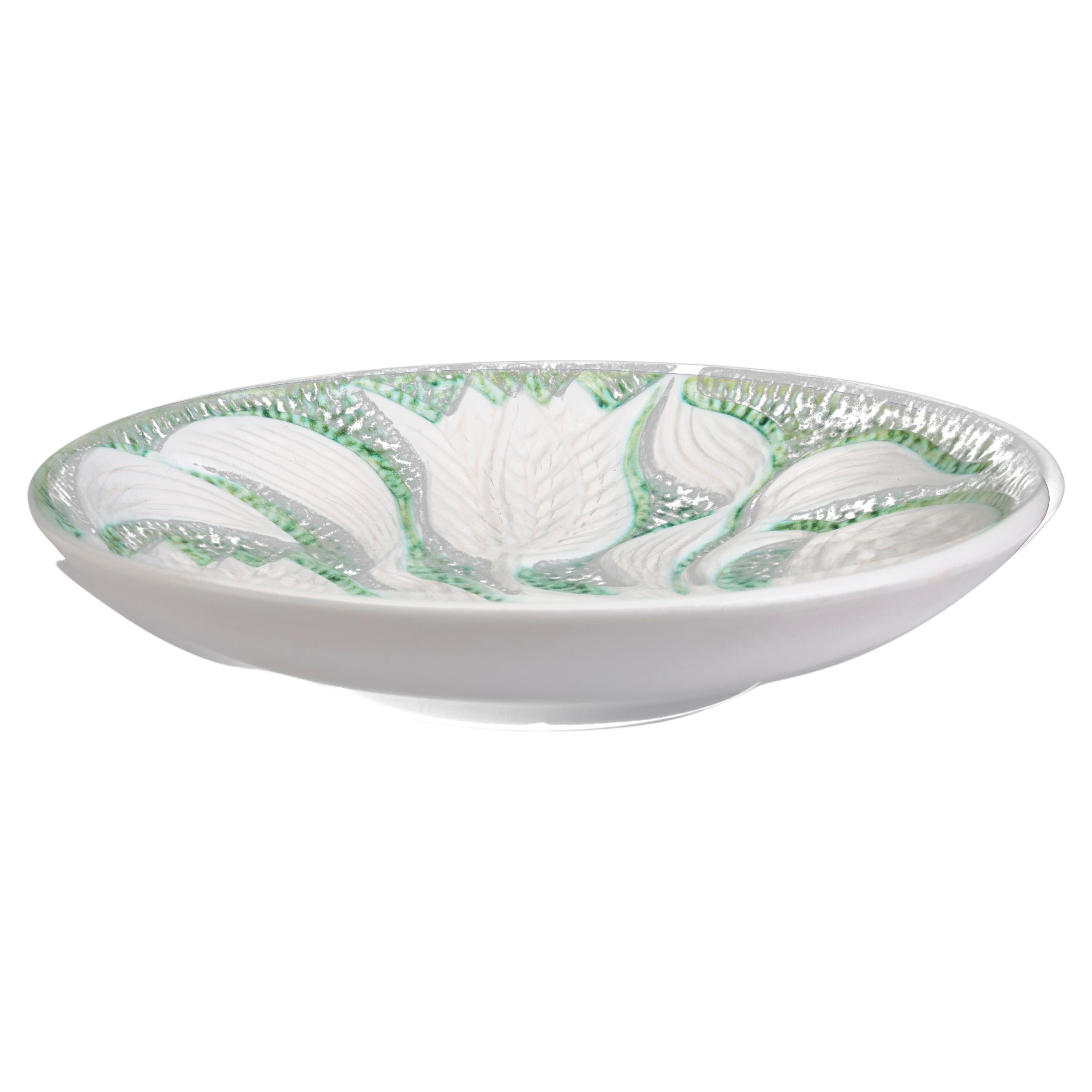 Large dish decorated with serpentine flowers and glazed in white and light green For Sale