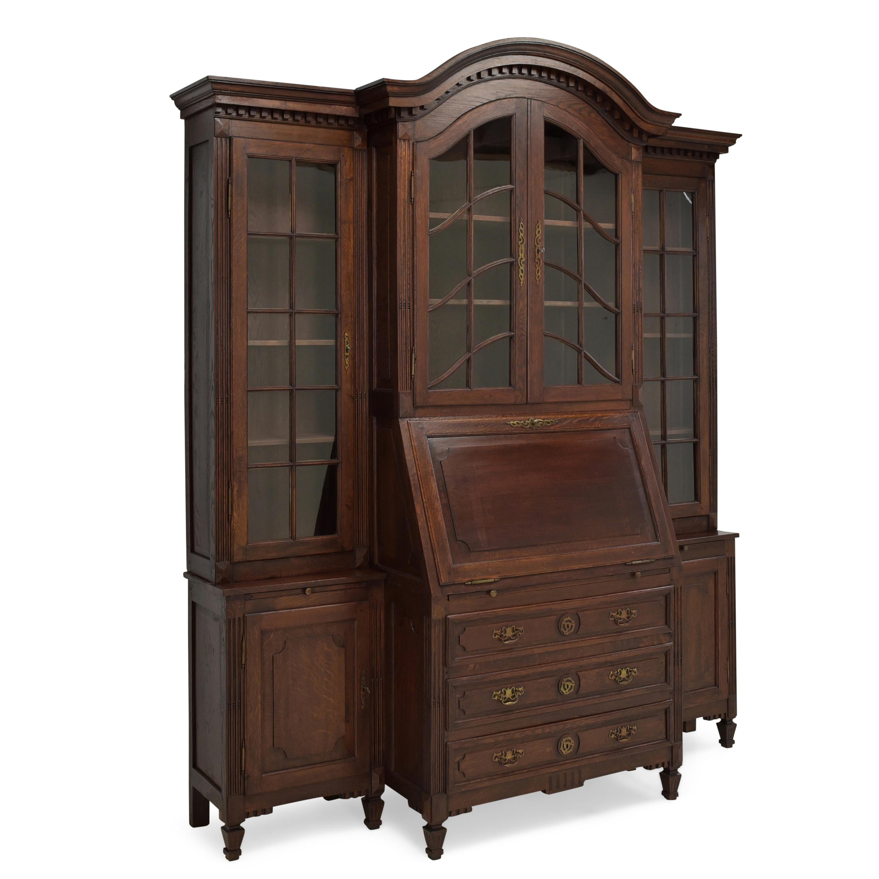 Large display cabinet with secretary restored oak bookcase

Features:
Six-door model with secretaire with three drawers and two extension leaves
Very high quality processing
All drawers dovetailed
Shelves of the upper part are