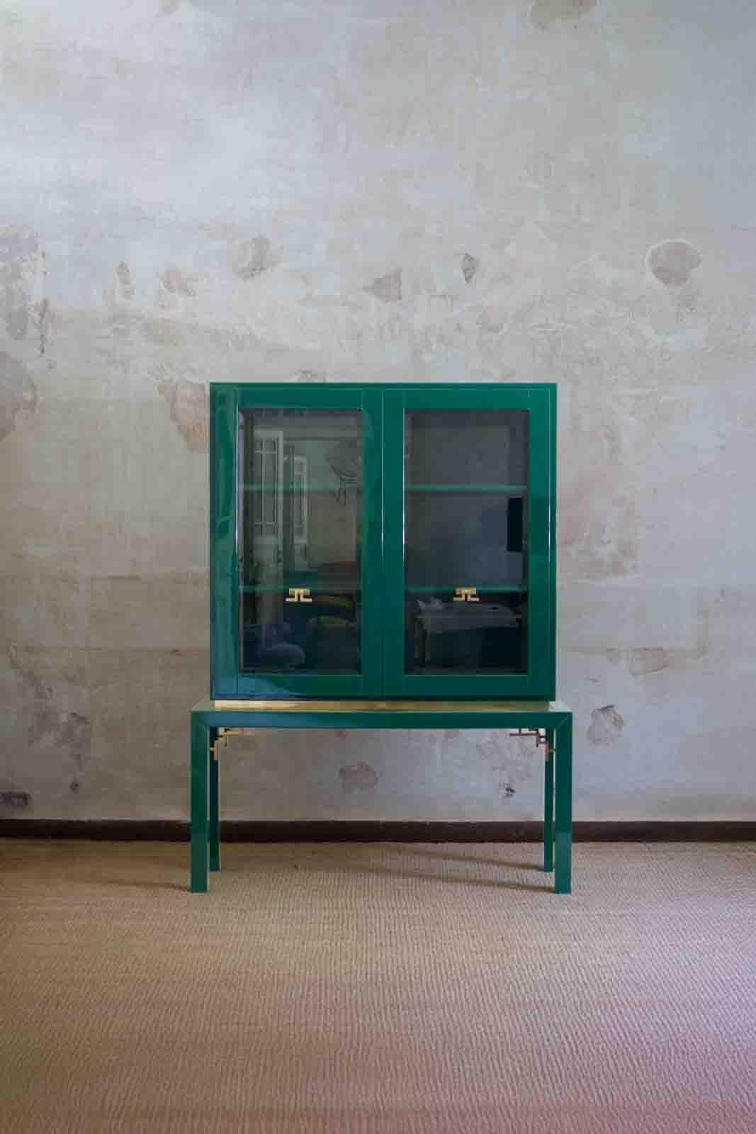 Large Display Cabinet in Green Lacquered wood with Brass Details
Product Details
Featuring glass doors and internal wooden shelves
Re-lacquered, with no visible signs of wear.
Dimensions: 133 W × 180 H × 37 D cm