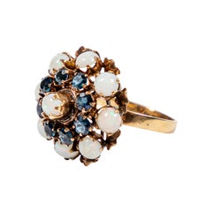 Retro Large Dome Cocktail Ring with Opals and Sapphires Set in 14K Gold, circa 1960s