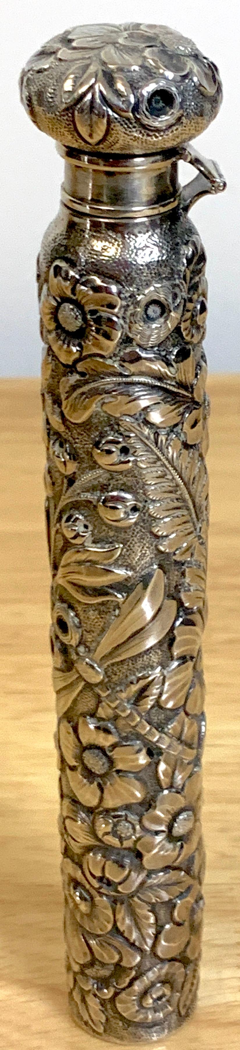 Large Dominick & Haff aesthetic sterling perfume or flask with dragon fly, a choice example, a tall profusely repoused with florals and leaves. Complete with locking hinged circular top, with cork interior. Stamped Dominick & Haff, Retailed by