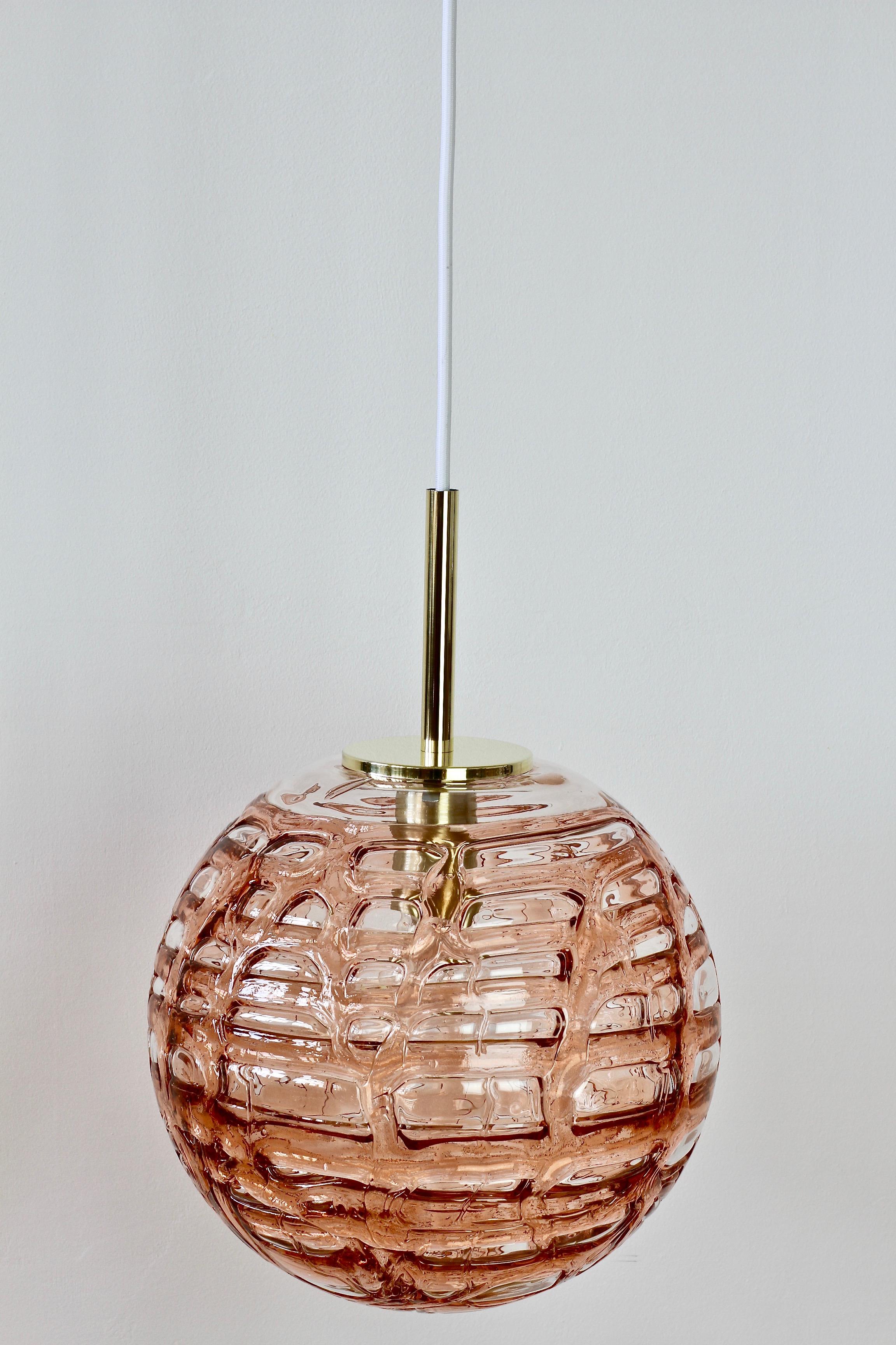 Large vintage rose pink tinted midcentury Murano glass ceiling pendant light fixture by Doria Leuchten, Germany. Made in the later half of the 1960s, this gorgeous pendent features wonderfully made, mouth blown Murano glass which looks like melting