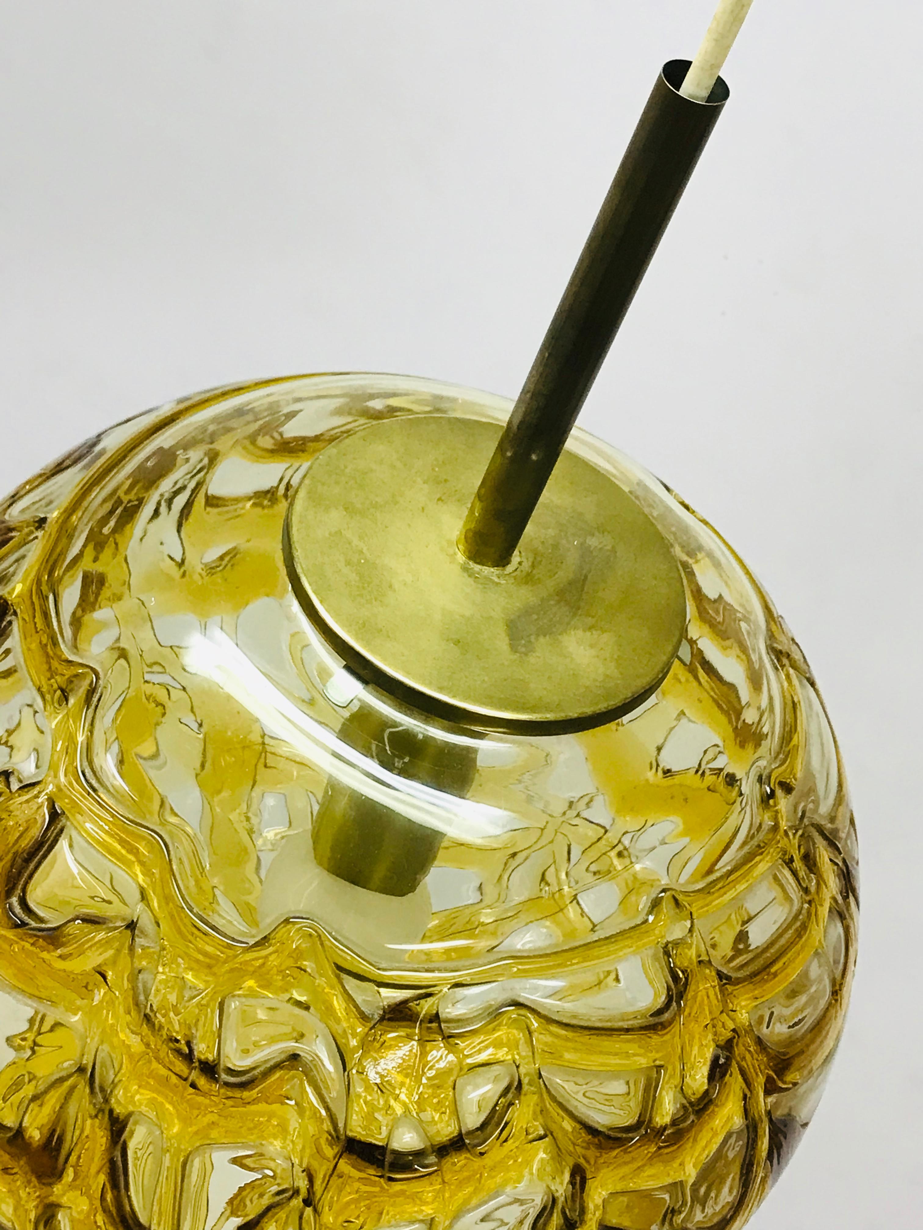 The lamp Temde Leuchten is model 747. The lightning Murano is crystal made of two cover glass, clear inside and orange dark amber color outside. The orange and dark amber outside glass is irregular layer. The diameter of the glass bowl is 35 cm. Use