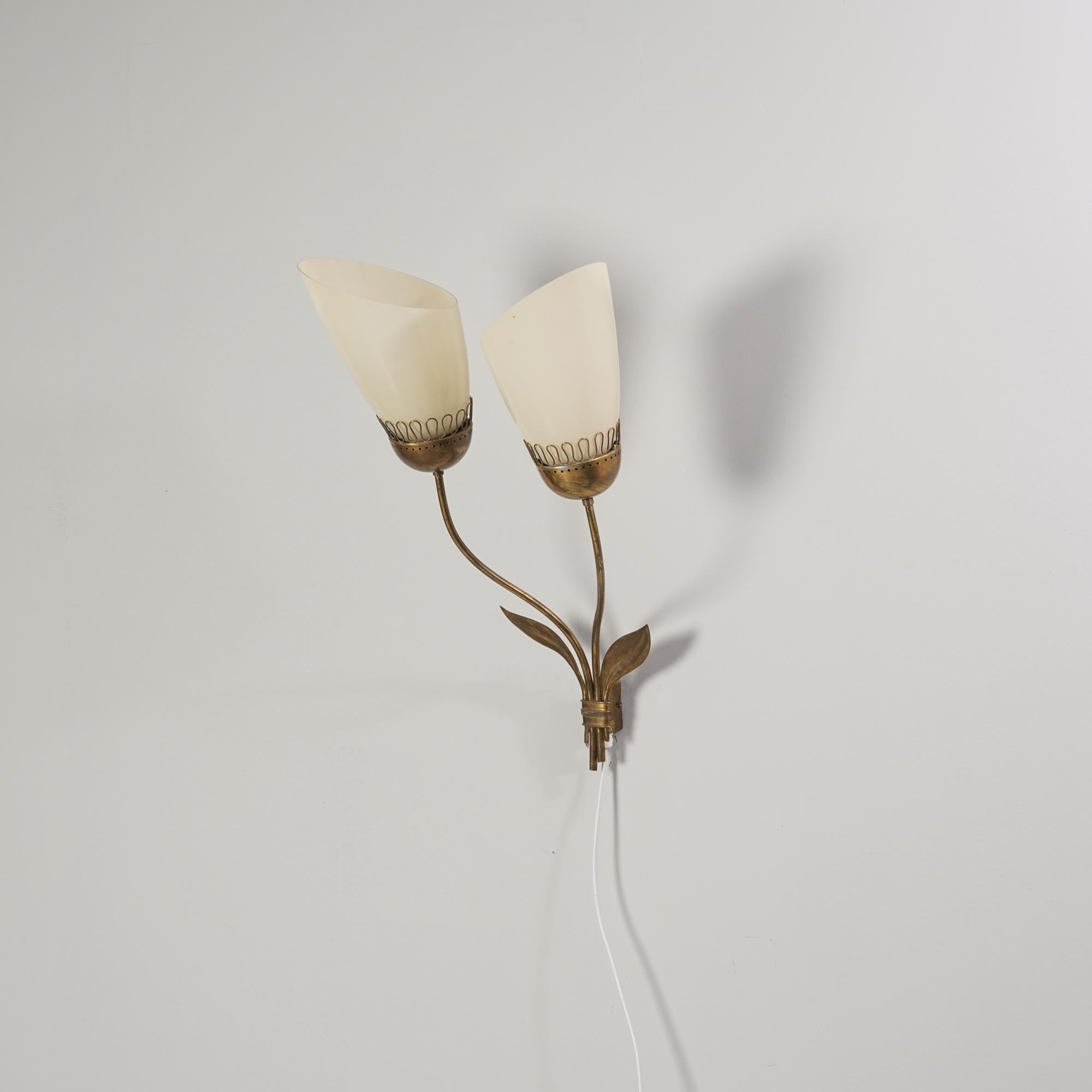 Large double armed wall light in the style of Paavo Tynell, 1940s. Brass frame with opaline glass shades. Good vintage condition, patina consistent with age and use. 