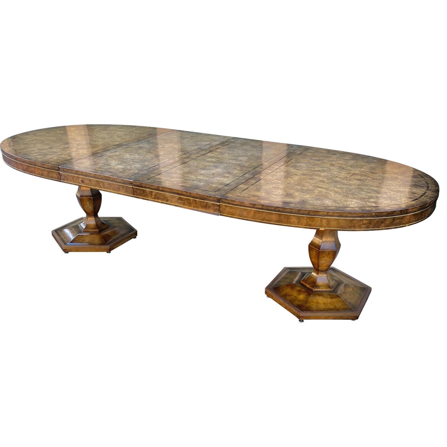 Large oval double pedestal burl and elm dining room table on with two original extension leaves. 
Each leaf measures 20 inches wide, bringing the total width/length to 110 inches (9 feet and 2 inches).

  
