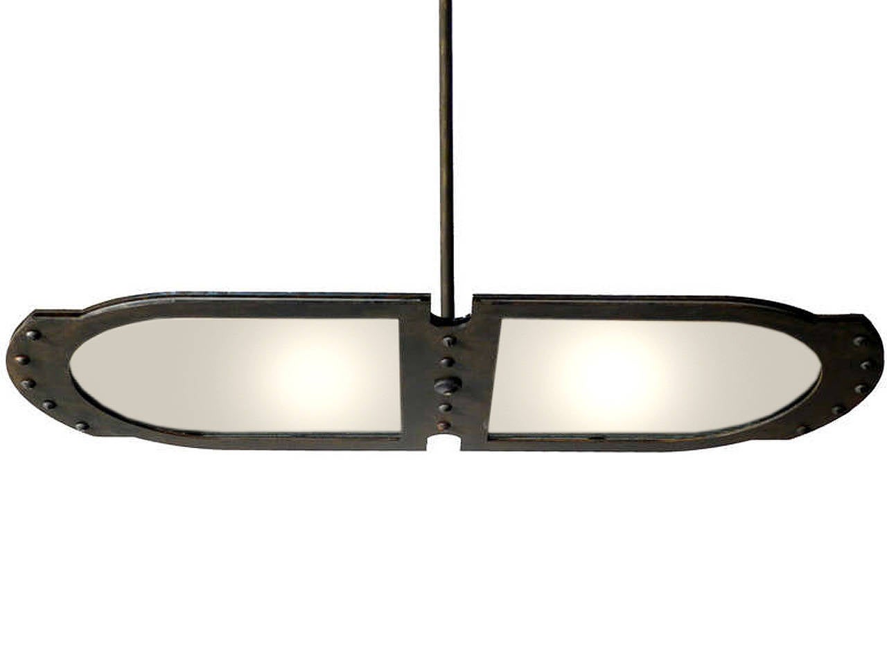 This large tracery style Industrial pendant fits comfortably with most styles. It's very architectural with clean lines… just look at the profile. The heavy steel frame has an aged patina and Industrial accents that are not over done. We designed