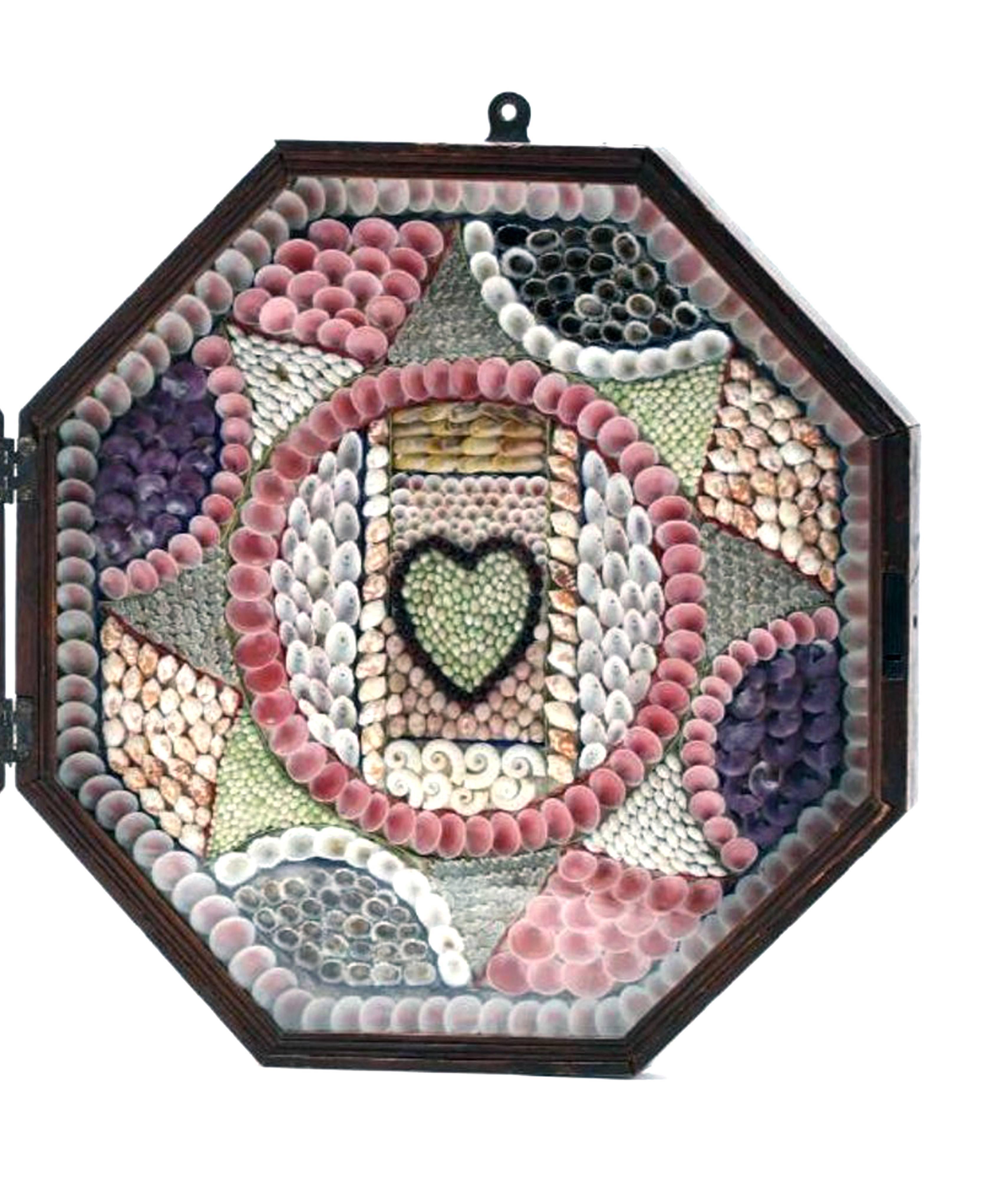 Large double sailor's valentine, Barbados,
circa 1885.

A large double sailor's valentine with one side with an anchor and the other side with a heart surrounded by arrays of sea shells within a mahogany box.

Dimensions: 28 inches wide x 14