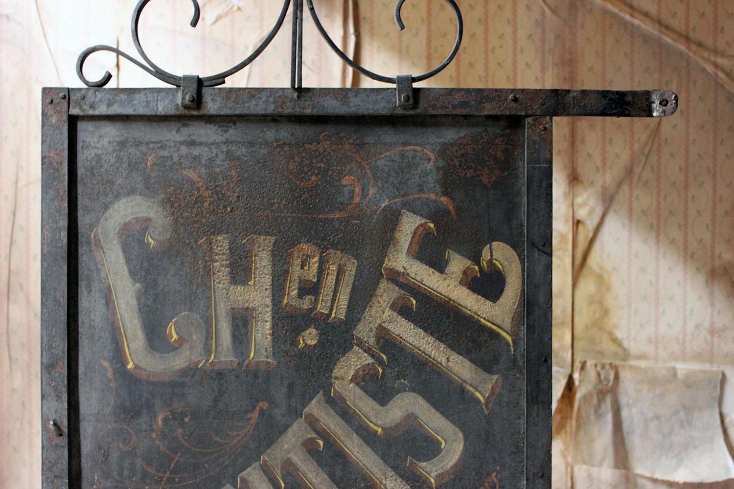 The hand-cut and riveted double-sided cast iron and sheet metal dentists trade sign of rectangular form, showing an outstanding patina to both sides bearing the original red and yellow paint to a black ground, reading ‘Ch en. Dentiste’ (Chirurgien