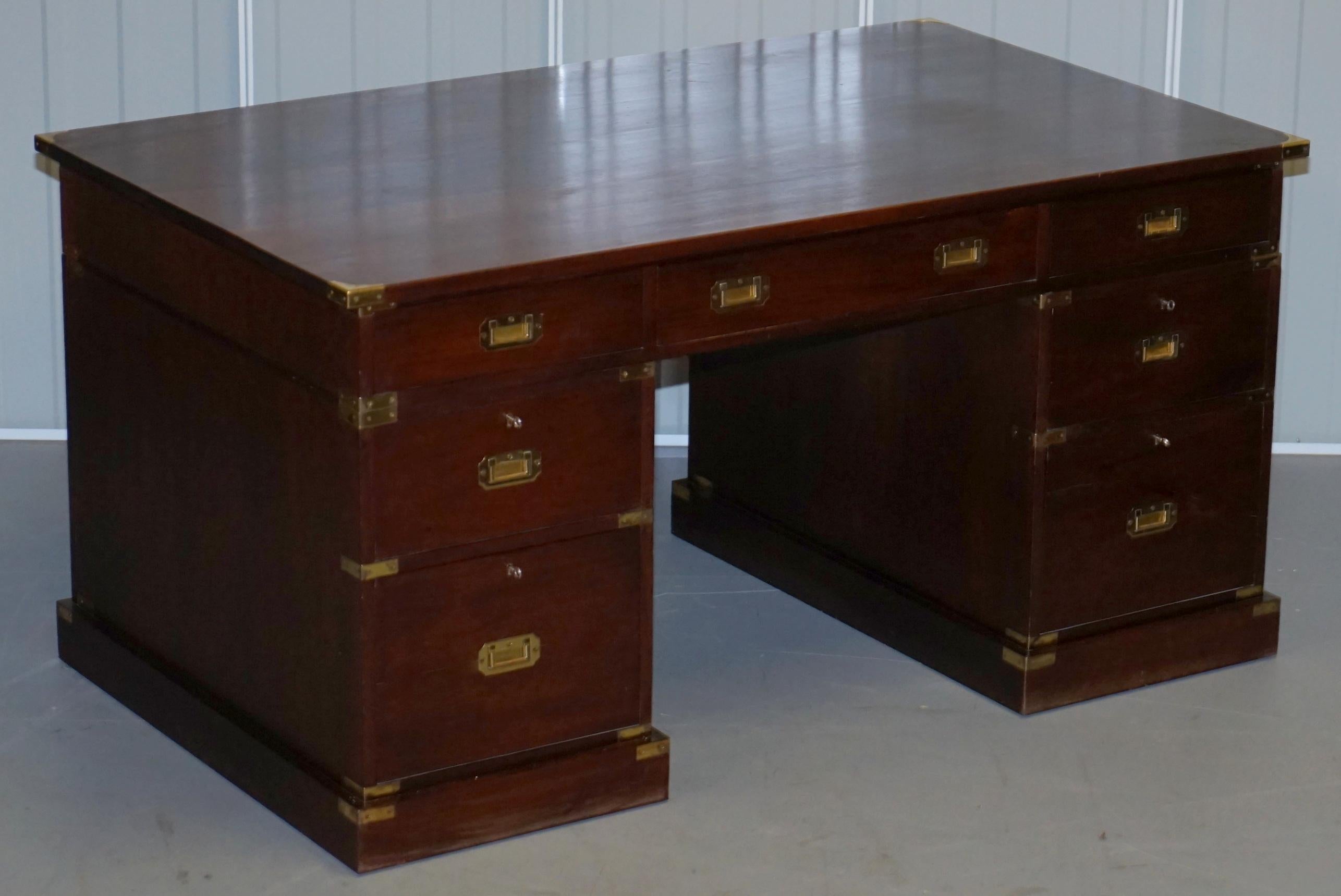 We are delighted to offer for sale this lovely very solid double-sided with bookcase back, hand made Military Campaign twin pedestal partner desk in solid mahogany and satinwood

I have the matching tall large three drawer filing cabinet listed