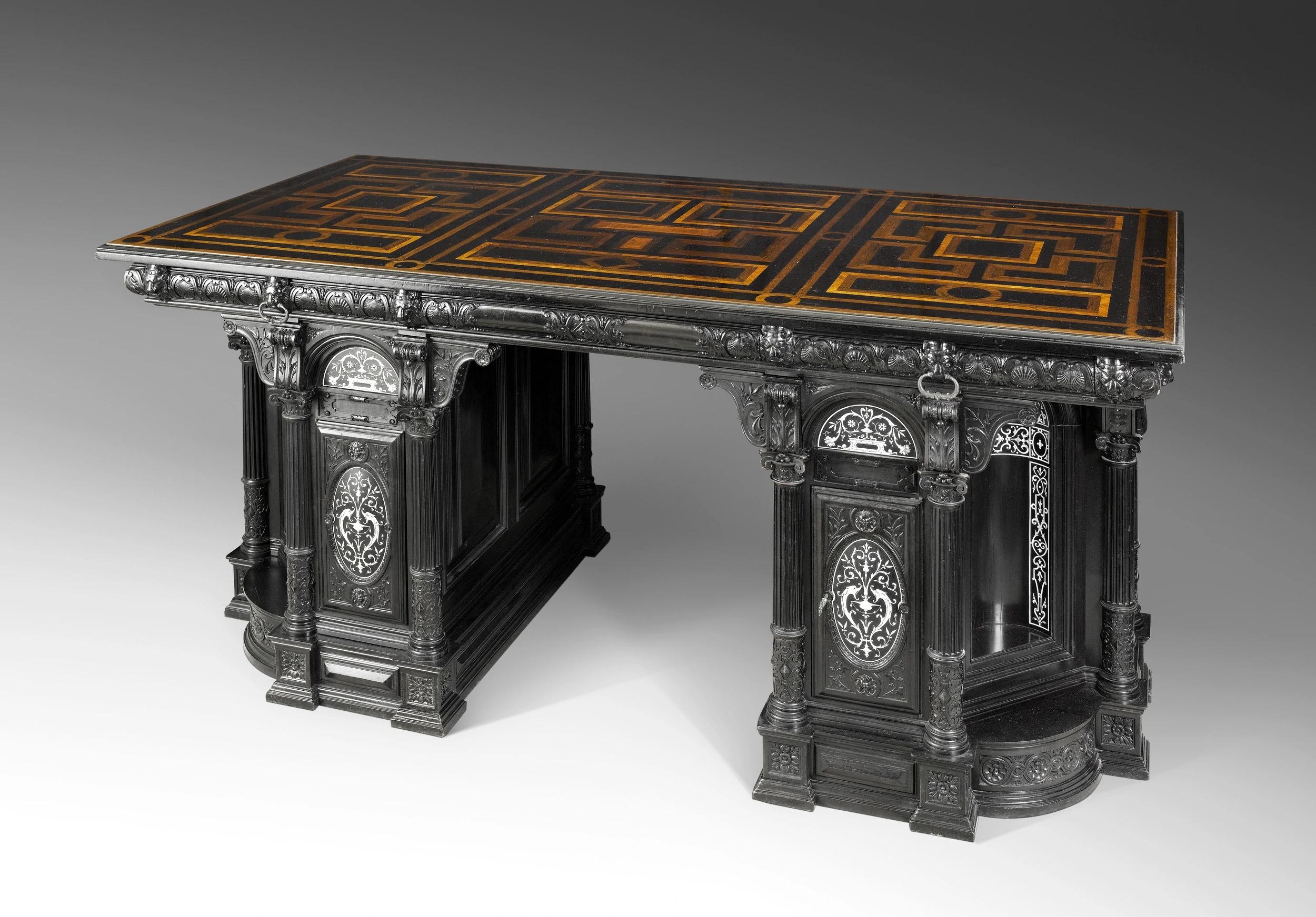 Large double-sided Renaissance-style writing-desk with secrets, stamped and inscribed by François-Pierre Leglas-Maurice.

It won a gold medal at the 1878 Paris Exposition Universelle. It is shown in the right-hand corner of the Renaissance cabinet
