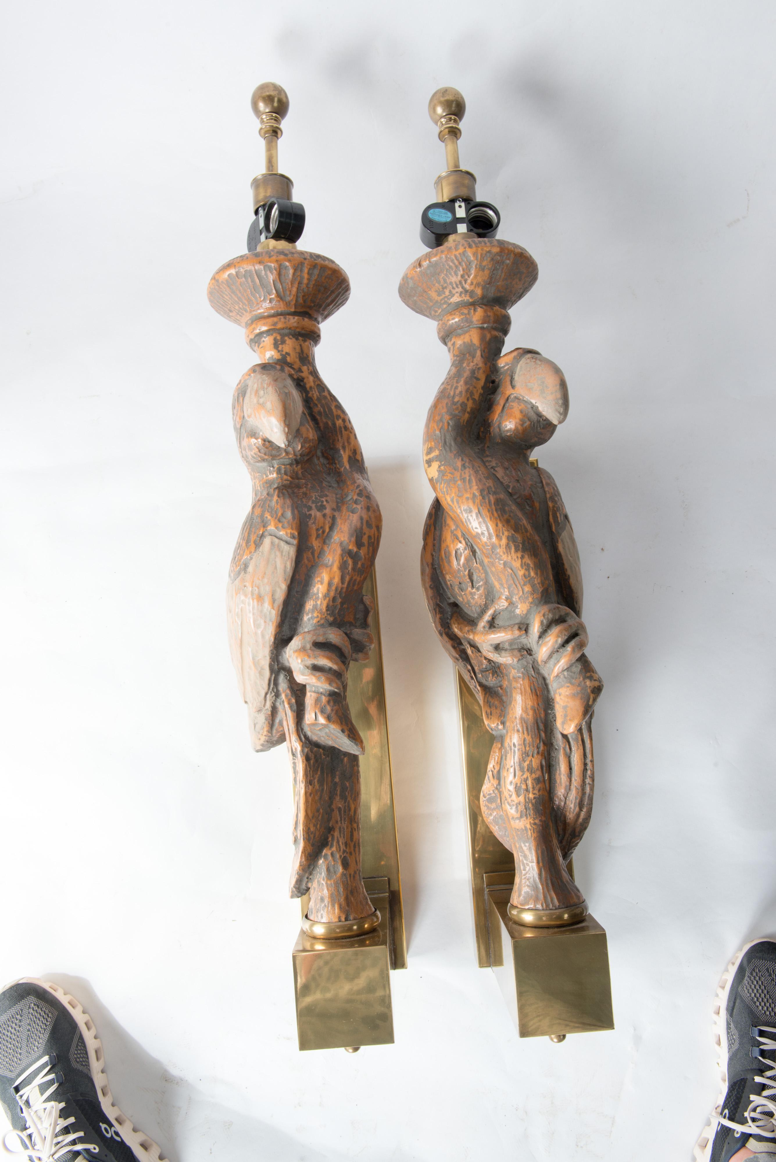 Manufactured by Hart & Associates a large pair of parrot sconces mounted on large brass boxed back plates. 
Each sconce holds two standard light bulbs. These are meant to have lampshades. Stunning for a pool house or a garden room.
 