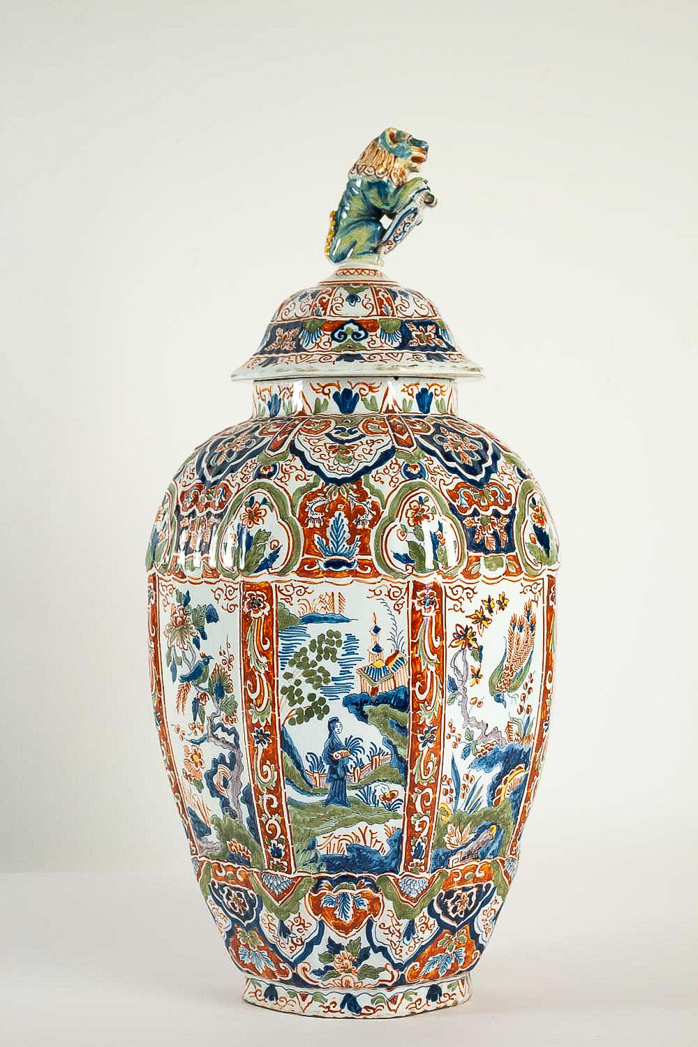 A beautiful and decorative large Delft faience polychrome vase, decorated with hand-painted stylized cashmere decoration, flowers, birds, opaque tin glazes that made in Delft 18th century.

Our vase is in excellent condition and signed in red color