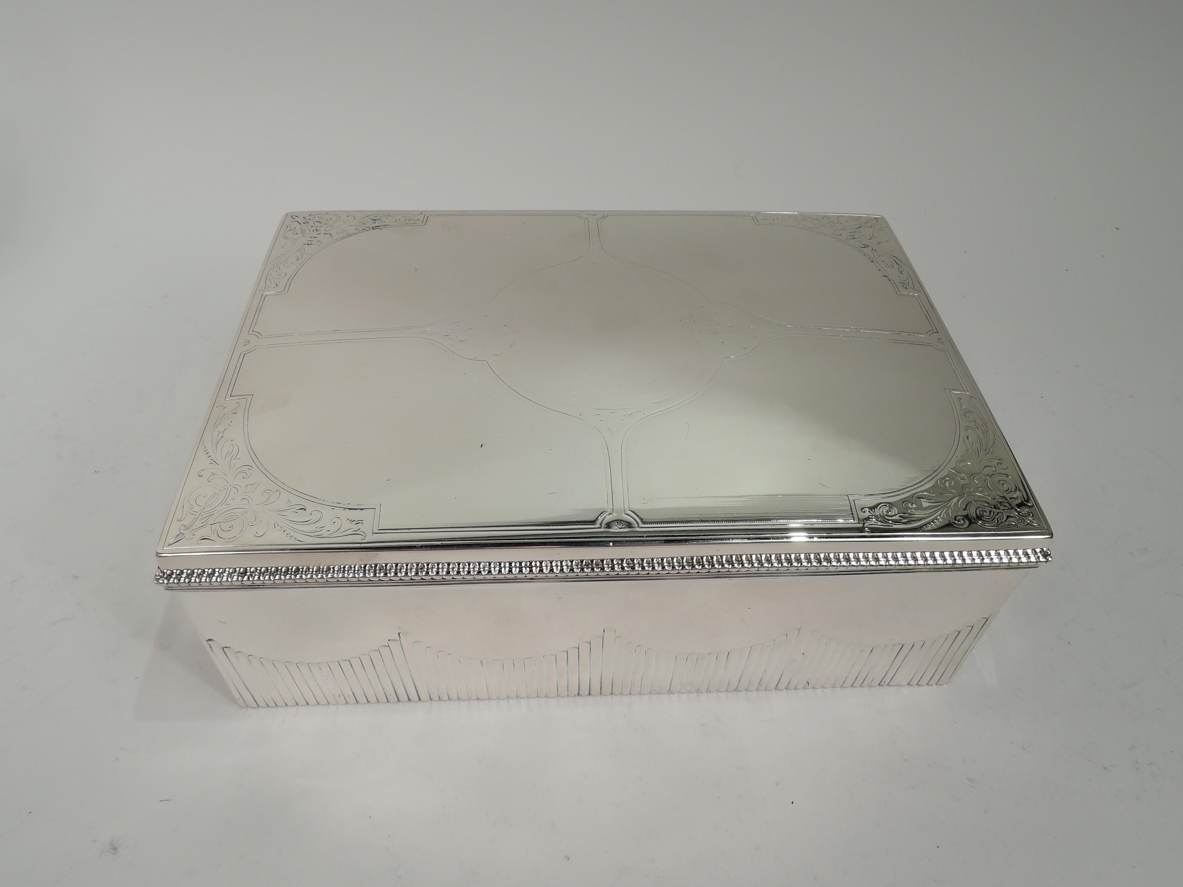 Large Dutch Art Nouveau Classical 833 silver box, 1915. Rectangular with straight sides wraparound fluted swags. Cover hinged with beaded rim. Cover top has central medallion with four stretches and fluid scrolling leaf ornament in curvilinear