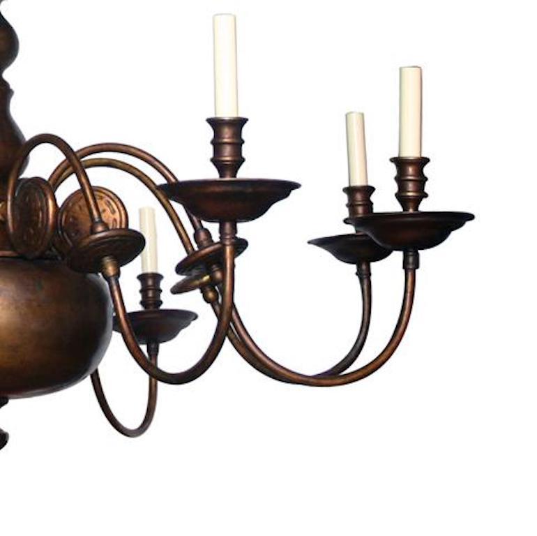 A large circa 1930's eight-arm Dutch bronze chandelier with original patina.

Measurements:
Minimum drop: 28