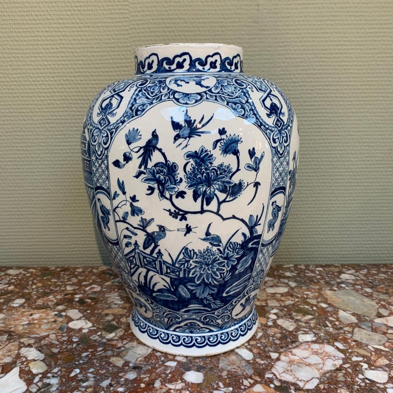 A Rare, Large, and Early Dutch Delftware vase with chinoiserie decoration.

Origine: Delft, The Netherlands
Date: Early 18th century
Workshop: Unknown, but looking at the quality of the painting and glaze, probably De Metaale Pot.

The vase is