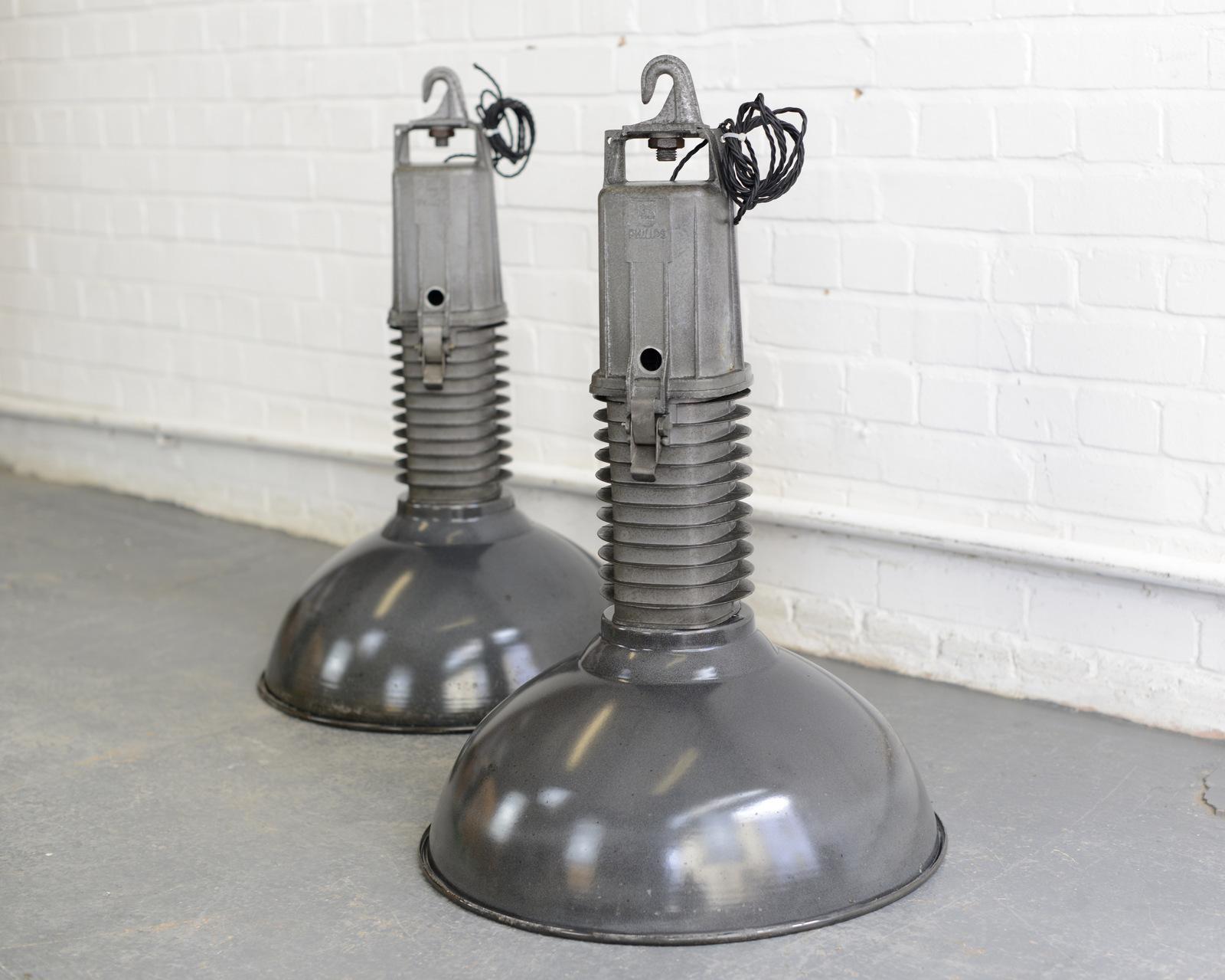 Large Dutch Industrial Lights By Phillips, circa 1950s.

Product code #OA851

- Worldwide shipping
- All prices including VAT
- Price is per light
- Vitreous black enamel shades
- Cast aluminium finned tops
- Takes E27 fitting bulbs
-
