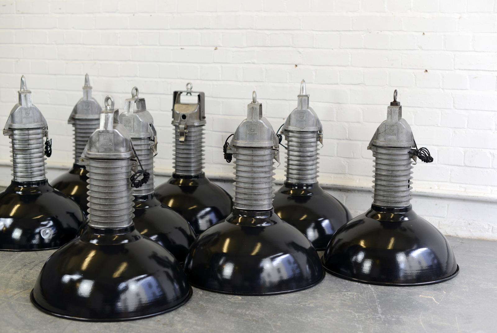 Large Dutch industrial lights by Phillips, circa 1950s.

- Price is per light
- Vitreous black enamel shades
- Cast aluminium finned tops
- Takes E27 fitting bulbs
- Comes with 100cm of black twist cable
- Comes with 100cm of suspension chain