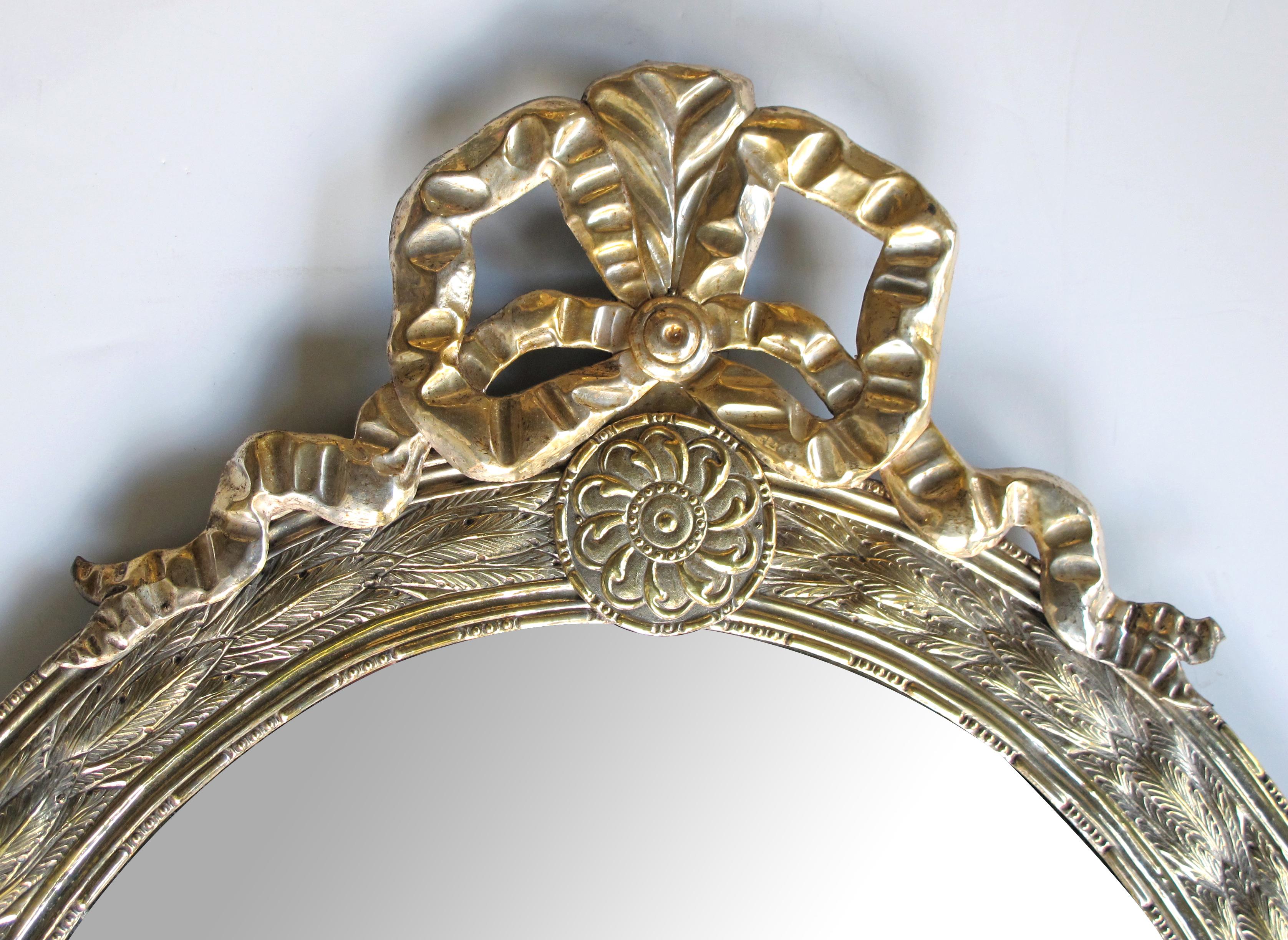 Large Dutch Neoclassical Style Silver and Gold Gilt Repoussé Oval Mirror In Good Condition For Sale In San Francisco, CA
