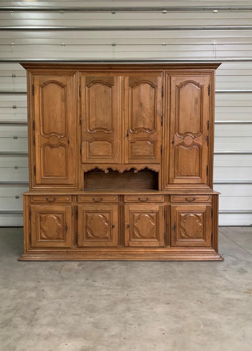 A monumental French early 18th century oak buffet cupboard. Cupboards/Buffets like this were used in castles and large mansions to either store the most valuable spices, linnen etc and keep track of the households finances or to hold the china,