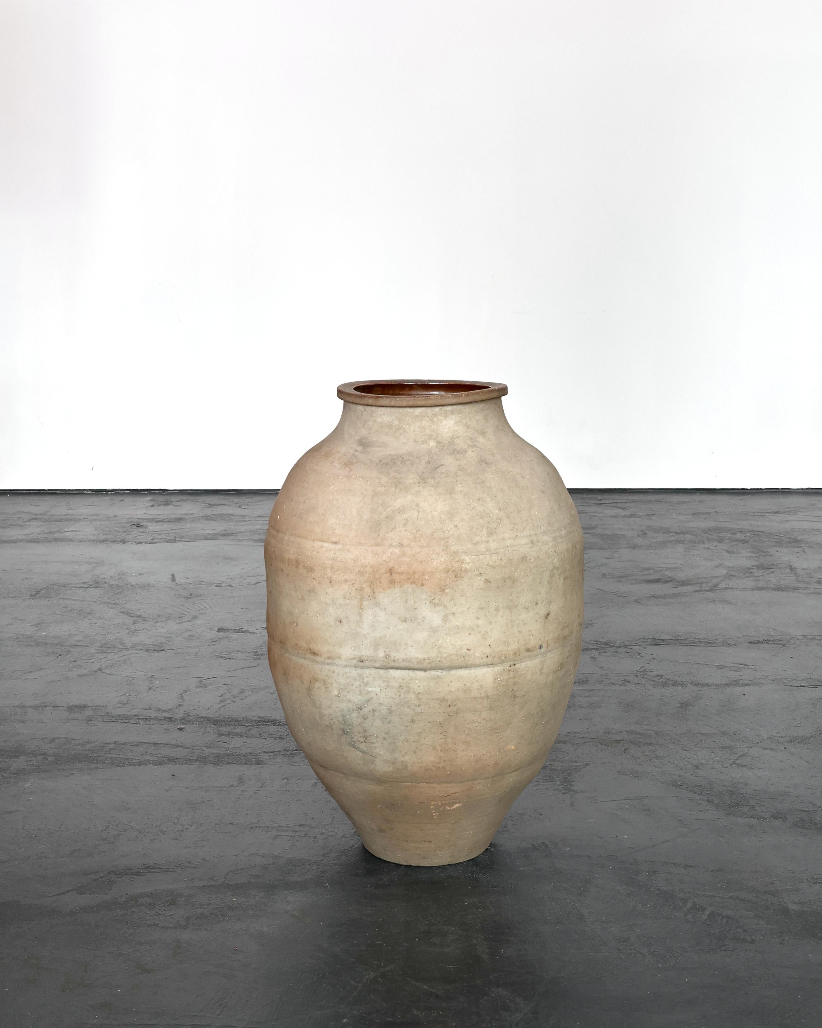 Large early 19th C.  Japanese terracotta vessel.

Originally used in a teahouse for the storage & transportation of tea leaves.

Beautiful light colour.

Heavily patinated due to its utilitarian past.
