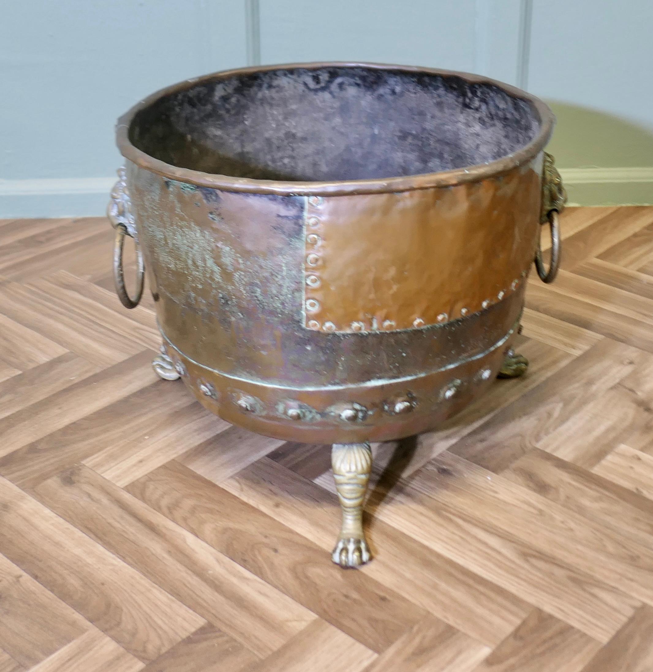 Large Early 19th Century Copper Log Cauldron

This is a lovely looking Cauldron, it has obviously been a much treasured piece, it has a large tinkered patch with riveted repairs
The Cauldron is in good sturdy condition with a charming patina, it has