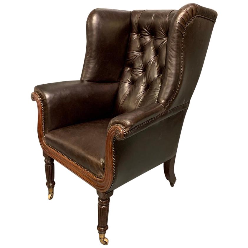 Large Early 19th Century Regency Buttoned Leather Wing Armchair on Castors For Sale