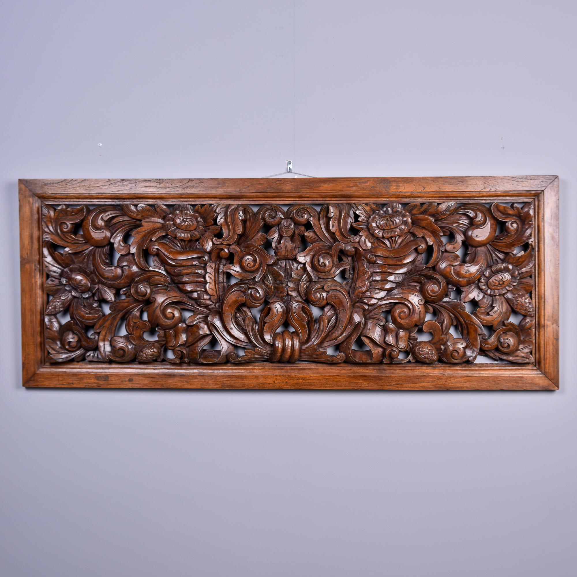 Found in the US. Unknown origin. Circa 1910 large hand carved and framed walnut panel. Very intricately rendered work featuring leaves, vines and flowers.  This is heavy piece and is over five feet long and two feet high. Unknown maker. Very good