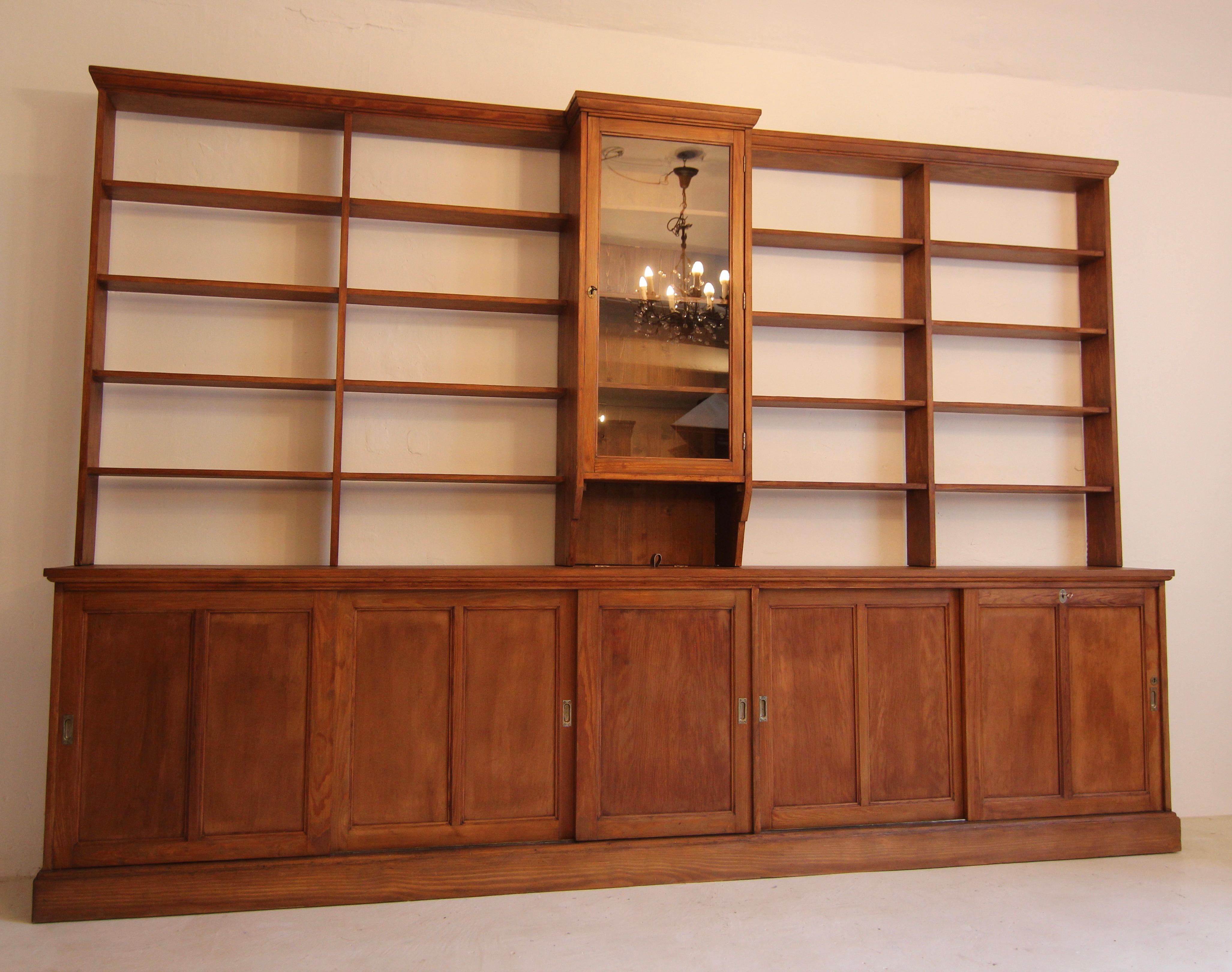 Large Early 20th Century Apothecary Shop Cabinet or Bookcase with Sliding Doors In Good Condition In Dusseldorf, DE
