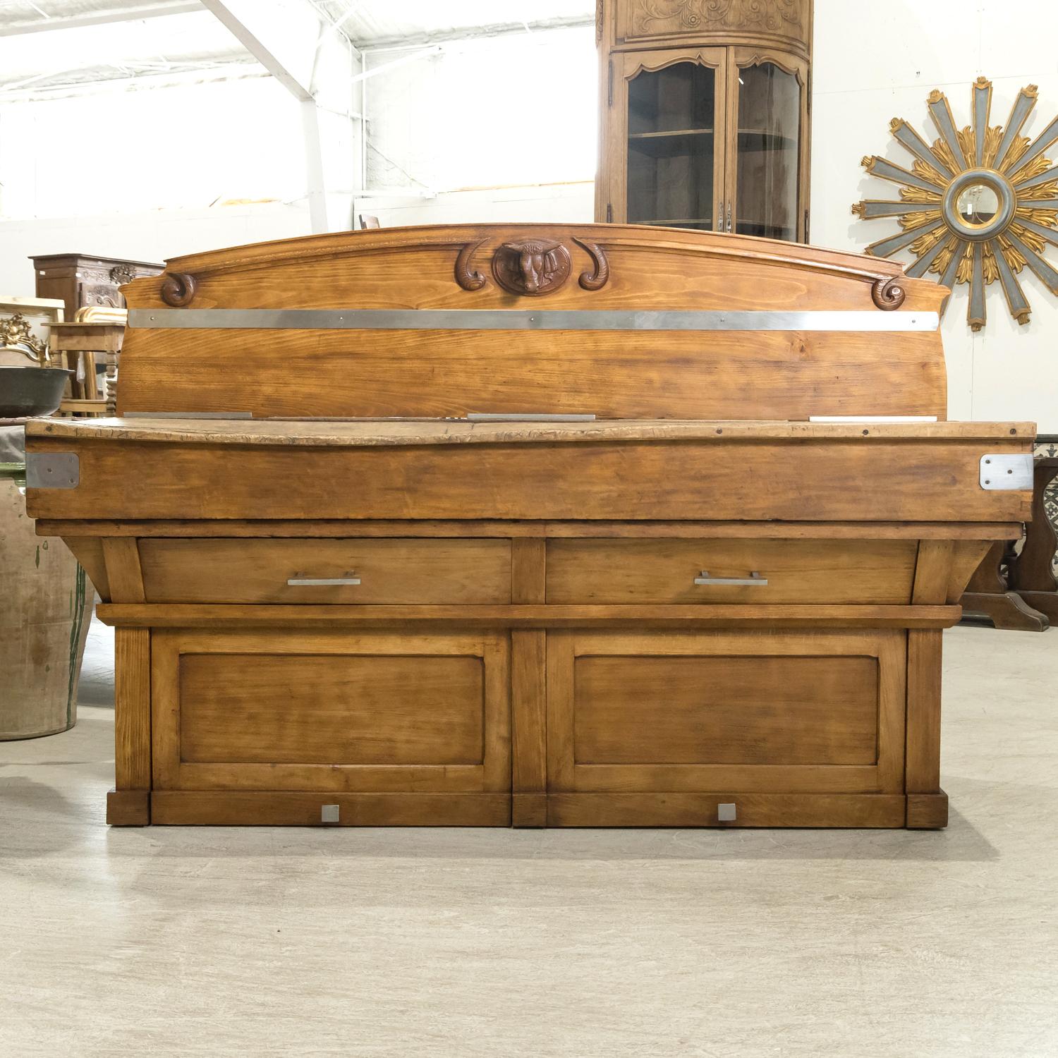 A superb early 20th century French double billot de boucher or butcher block, circa 1920s, handcrafted of mixed woods in Paris. Wonderfully constructed with thick, hand carved pieces of wood, the large chopping surface is in great original