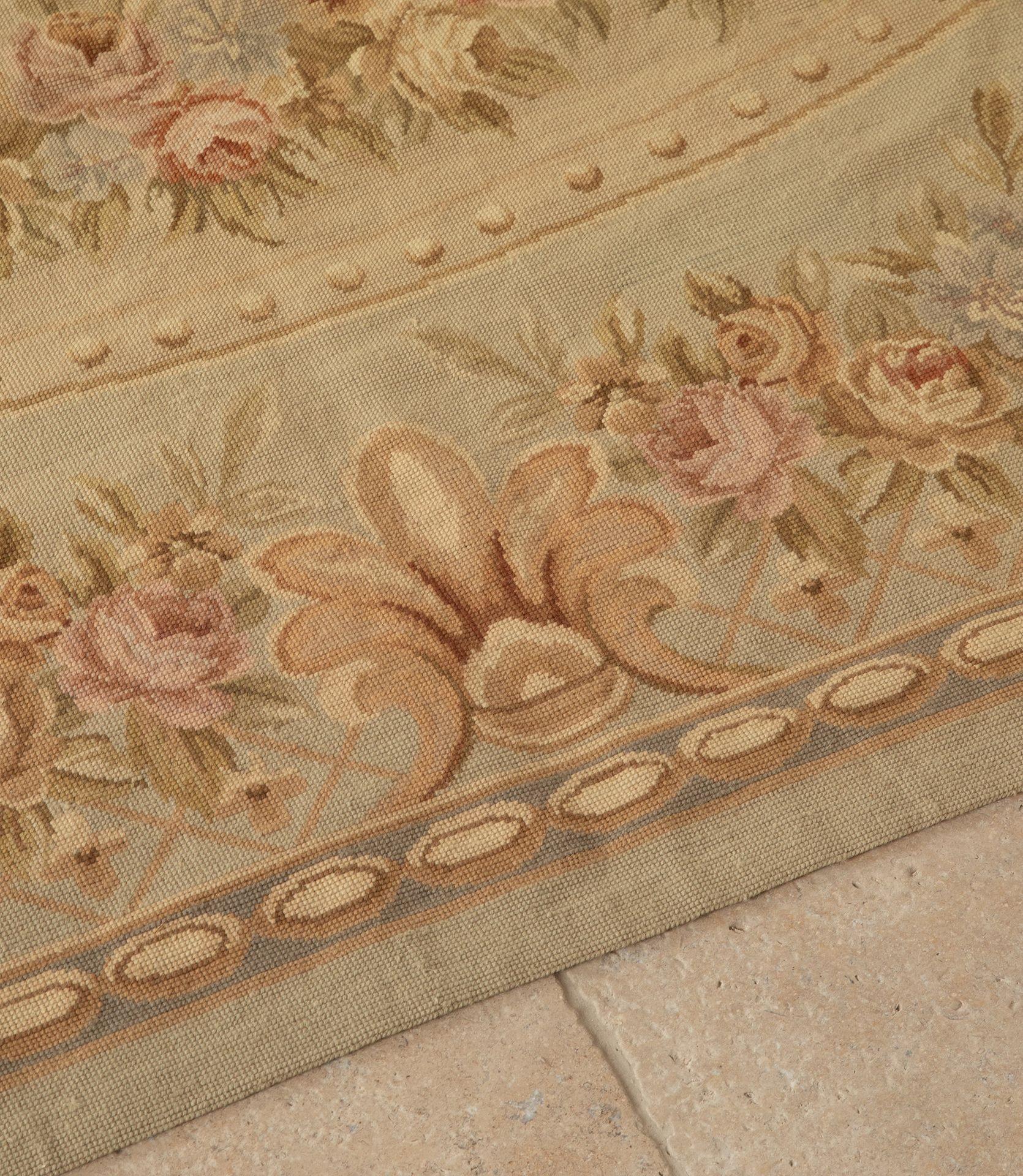 Large early 20th Century French hand-stitched tapestry Aubusson rug of grand proportions and quality. Elegant and delicate decorative design and colours makes it perfect to use as a wall hanging or a rug. In immaculate condition having been dry