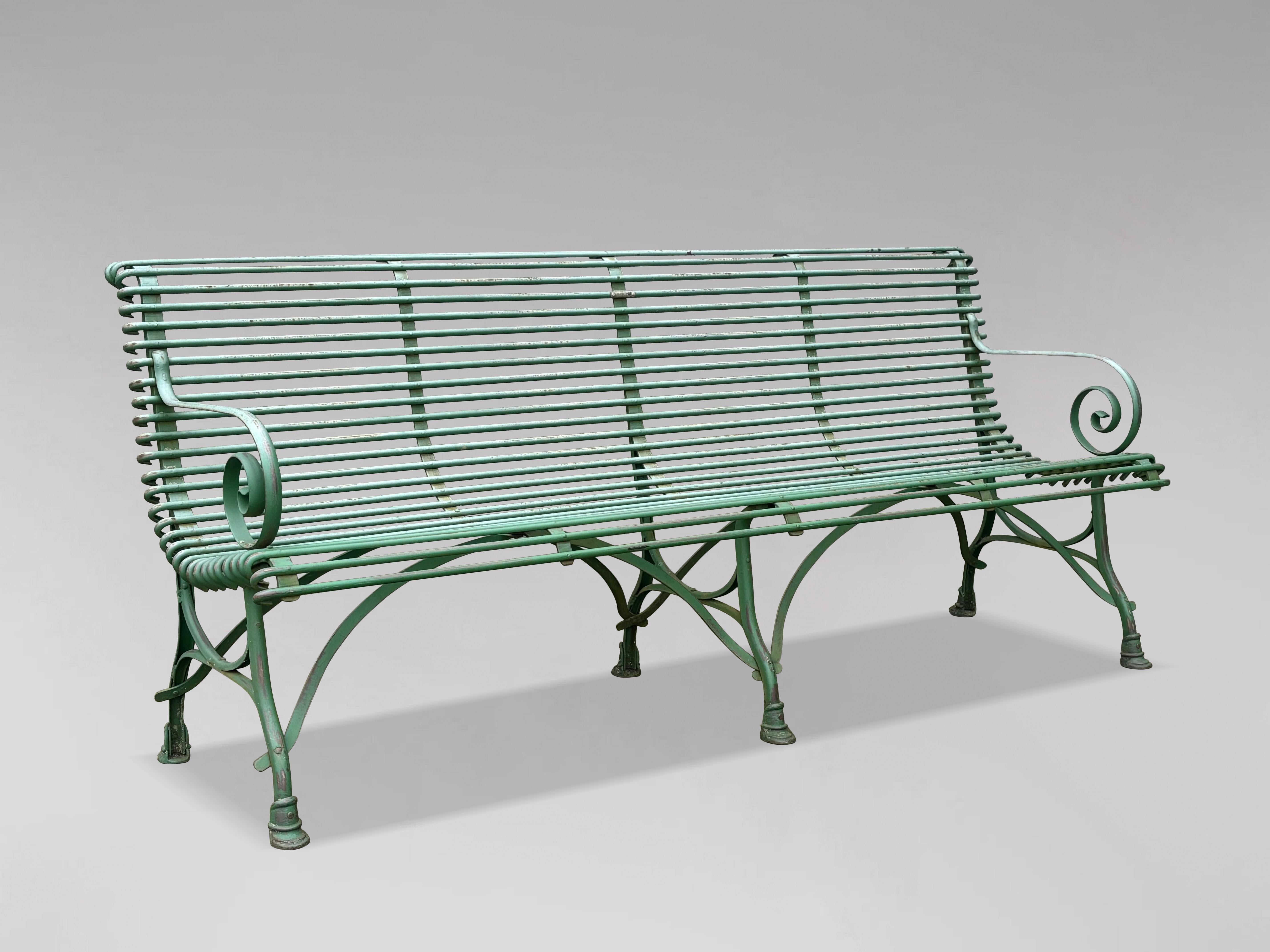 An Exceptional Early 20th-Century Large French Green Painted Wrought Iron Garden Bench by Grassin Arras

This superb French wrought iron garden bench, attributed to the renowned Grassin Arras, dates from the early 20th century. Its design
