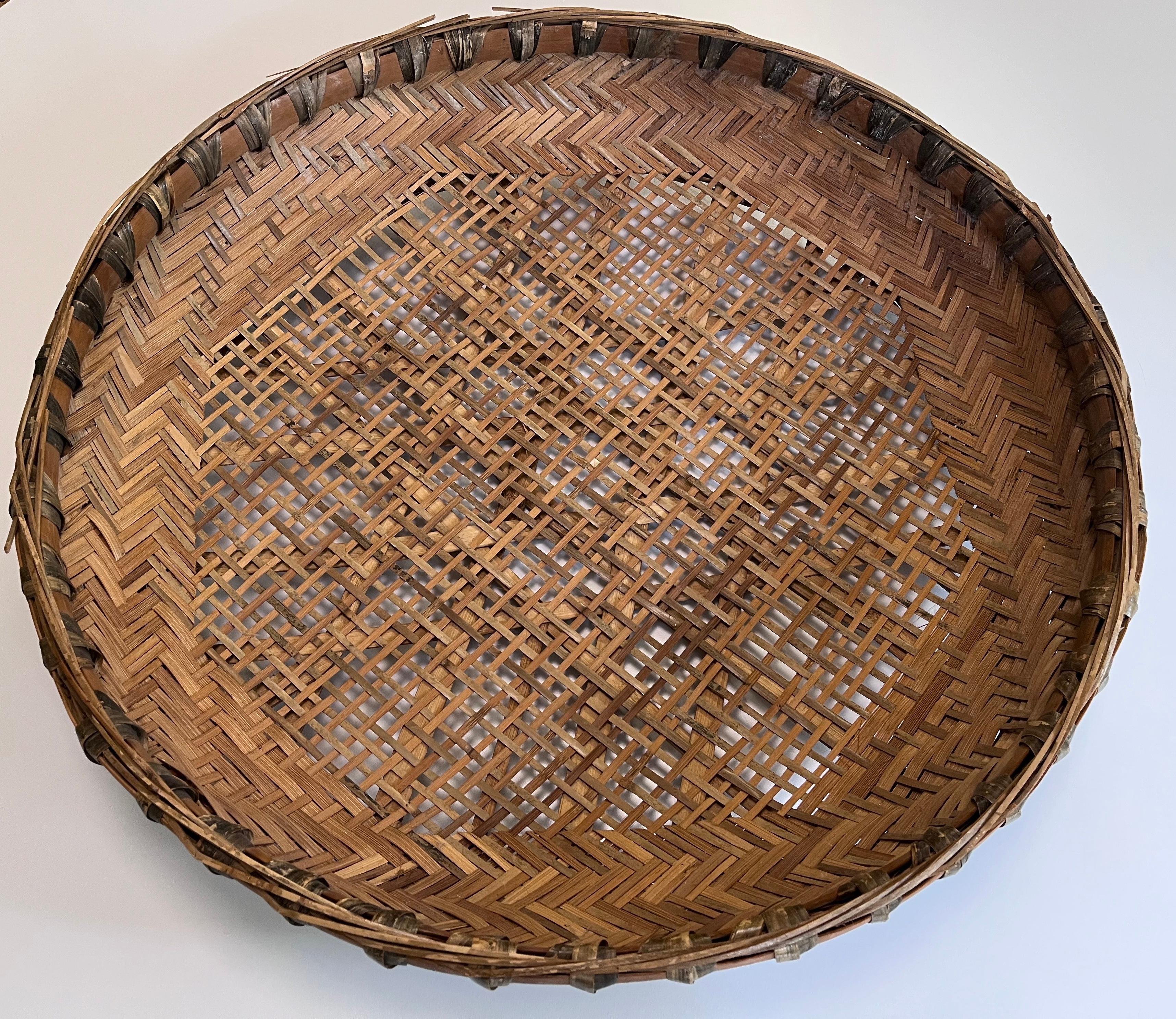 Large Early 20th Century Asian Hand-Woven Winnowing Basket – Folk Art Wall Sculpture

This large early 20th century hand-woven winnowing basket is a striking example of traditional Asian craftsmanship and makes for a stunning piece of wall art.