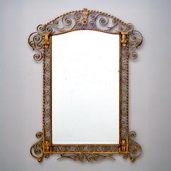 Gran espejo italiano de principios del siglo XX con marco de hierro dorado