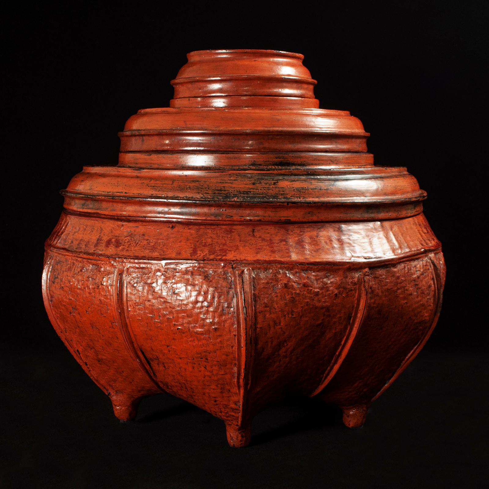 Large early 20th century lacquer and bamboo offering vessel from Burma

A large offering vessel composed of five pieces, which is fashioned from woven bamboo covered with a rich, thick lacquer. It measures 17.25 inches high by 18 inches in diameter