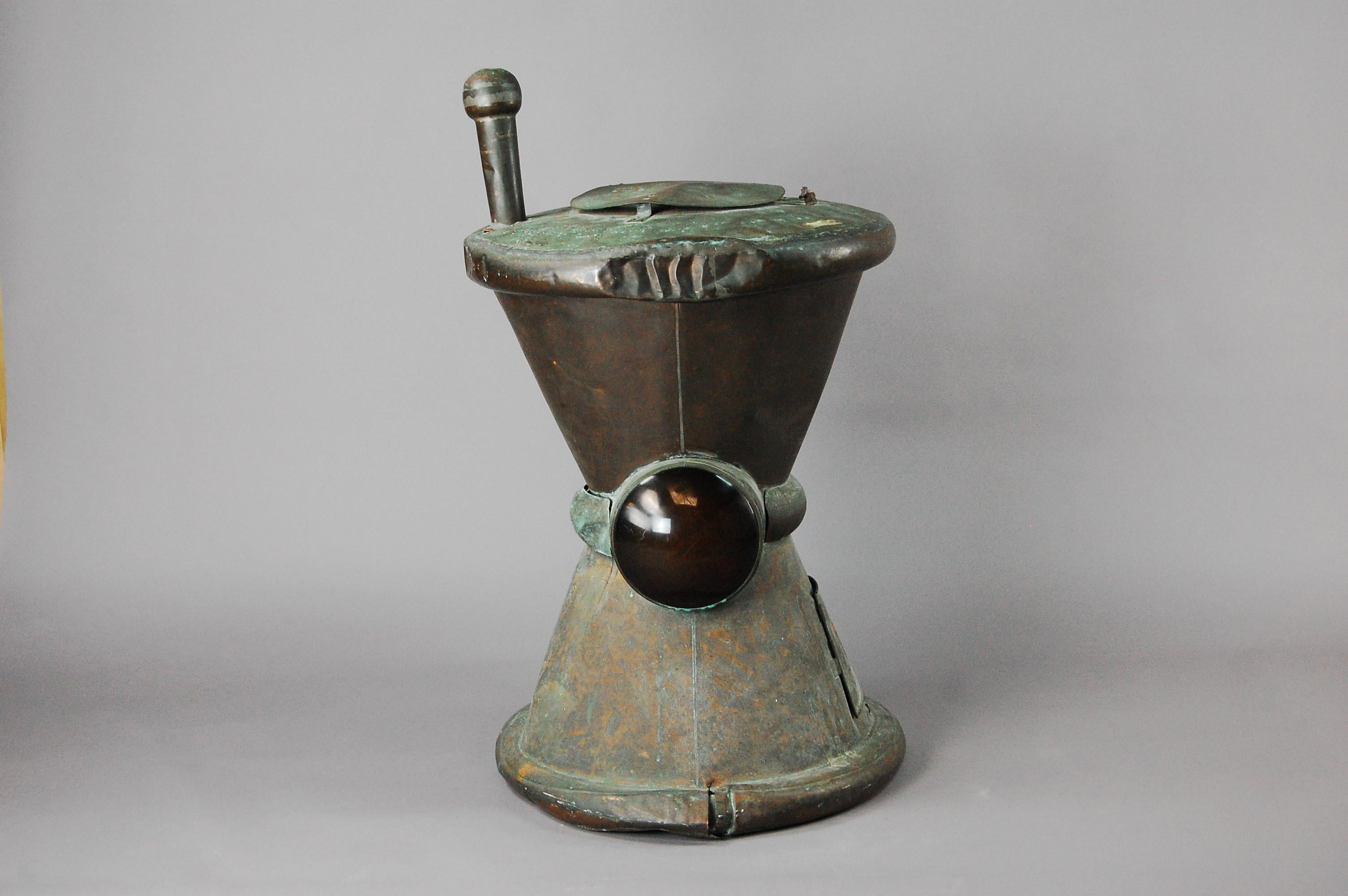Wonderful early 20th century copper pharmacy or chemist trade sign in the form of a pestle and mortar, oxidization and signs of natural verdigris showing, red lenses on each side would have been lit by gas lamp to make the sign more prominent and