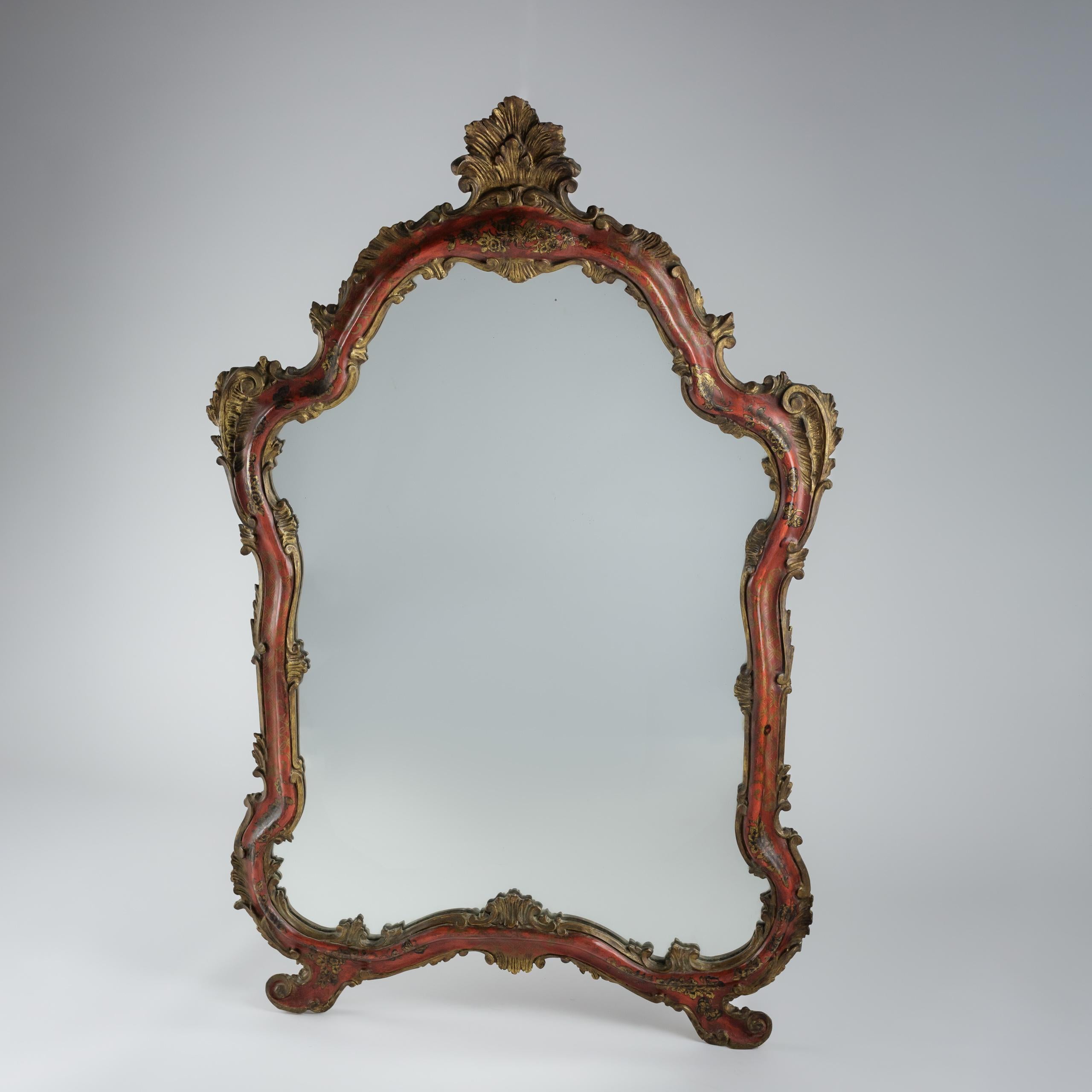Great Scale Early 20th Century Venetian Mirror, profusely decorated with florals and butterflies. Original glass with the lightest spots of foxing. Circa 1930.