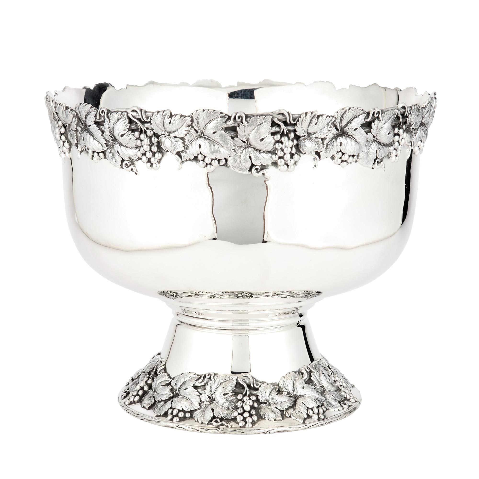 Experience the grandeur of the mid-20th century with our Large Sterling Silver Champagne Cooler / Punch Bowl, a masterpiece crafted by the esteemed Shreve & Co in San Francisco. This exquisite piece embodies the elegance of the era with its circular