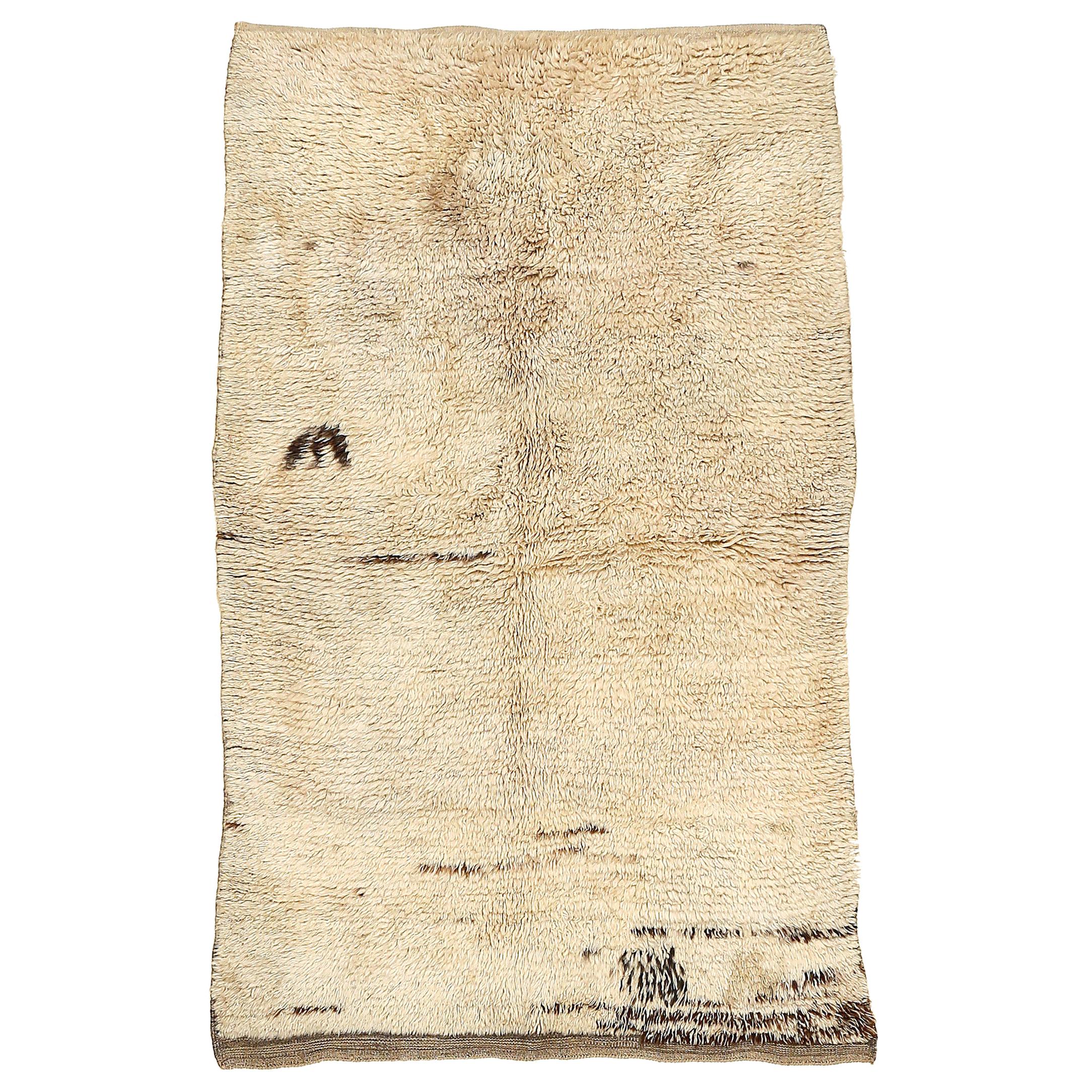 Large Early Ivory Minimal Tulu Rug