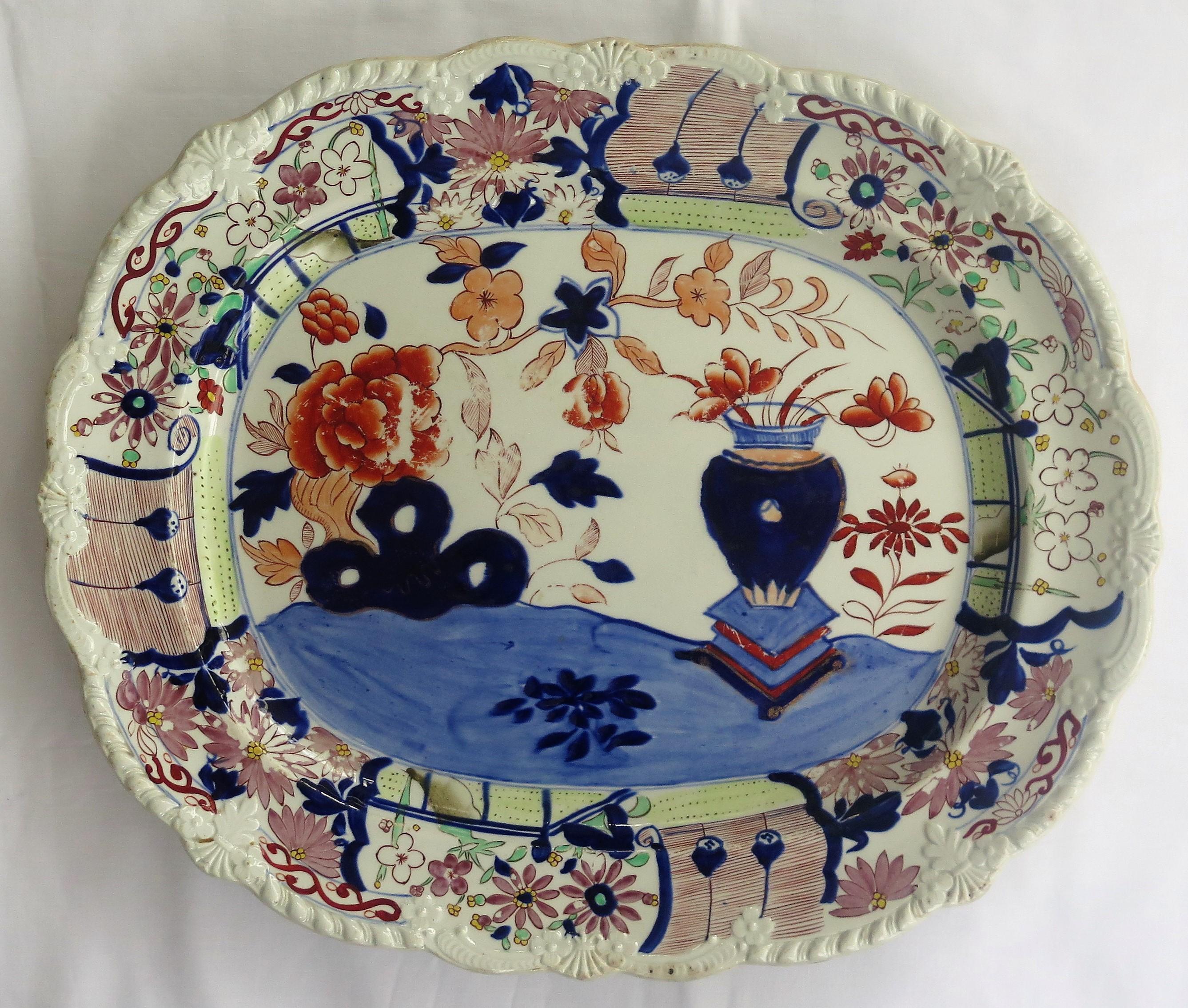 This a large, early 19th century platter of about 18 inch width made by Mason's Ironstone in the Vase and Rock hand-painted pattern, circa 1815. 

A very decorative and distinctive piece.

Very early 19th century Mason's Ironstone platters are rare