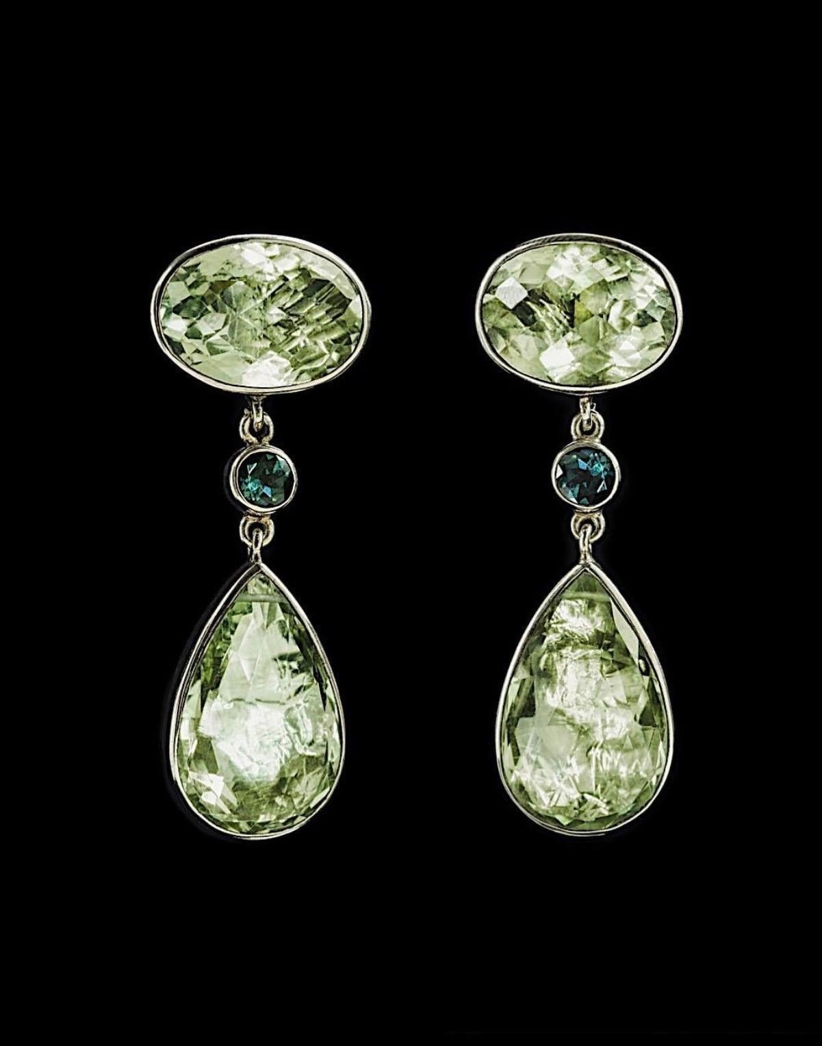 Jane Magon Collections Large Oval and Pear Shape light Green Tourmaline Earrings with a Two Bezel Set Green Quartz faceted Stones that dangle in Sterling Silver. Stamped 925 on the posts and JM on the tops. Measuring Two inches in length and weigh