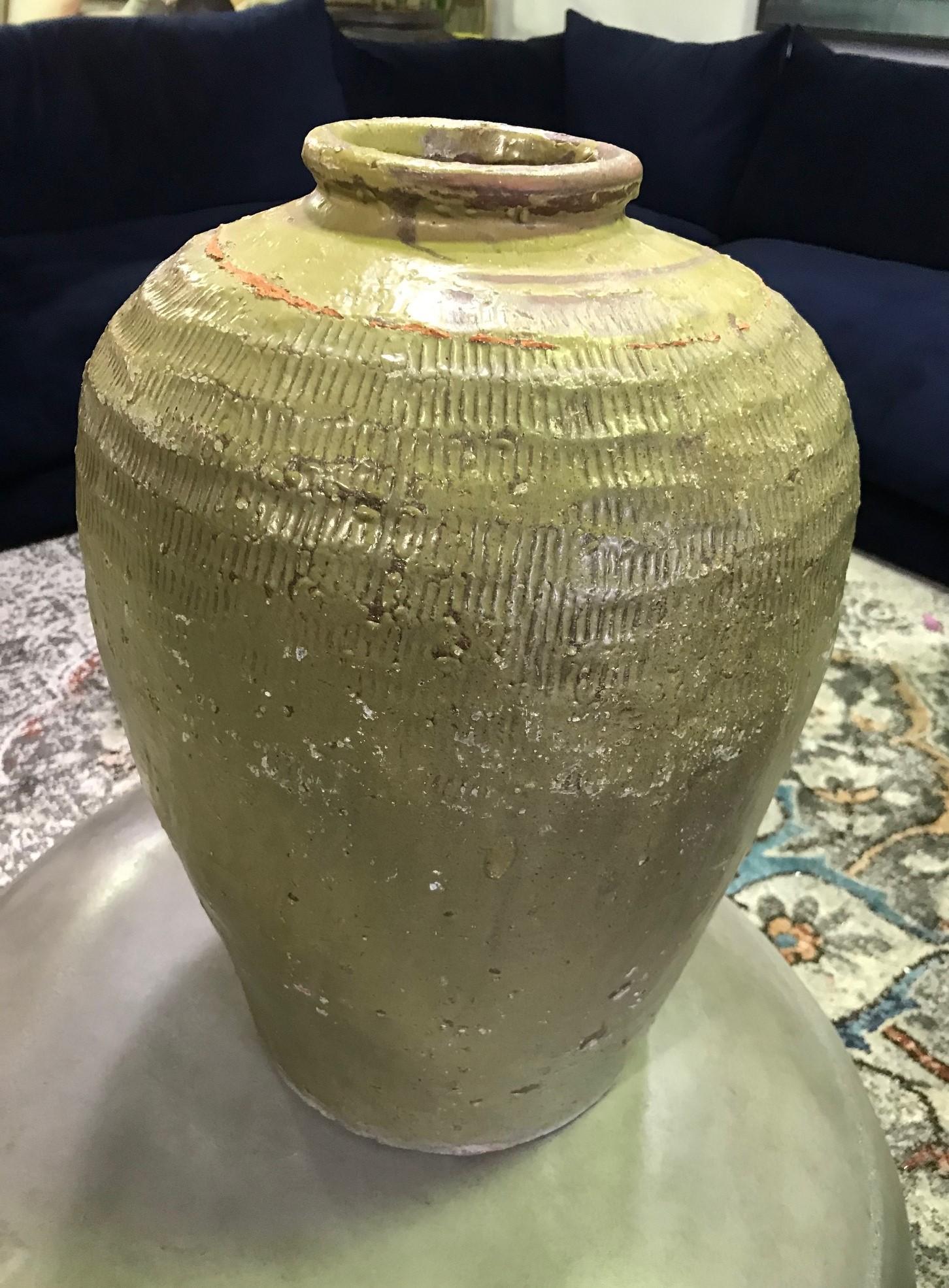A truly wonderfully made and textured, richly colored large earthenware vase or jar.

From a group of three vases (please see photos) we acquired from a high-end Southern California estate.

Would clearly stand out in about any setting indoors