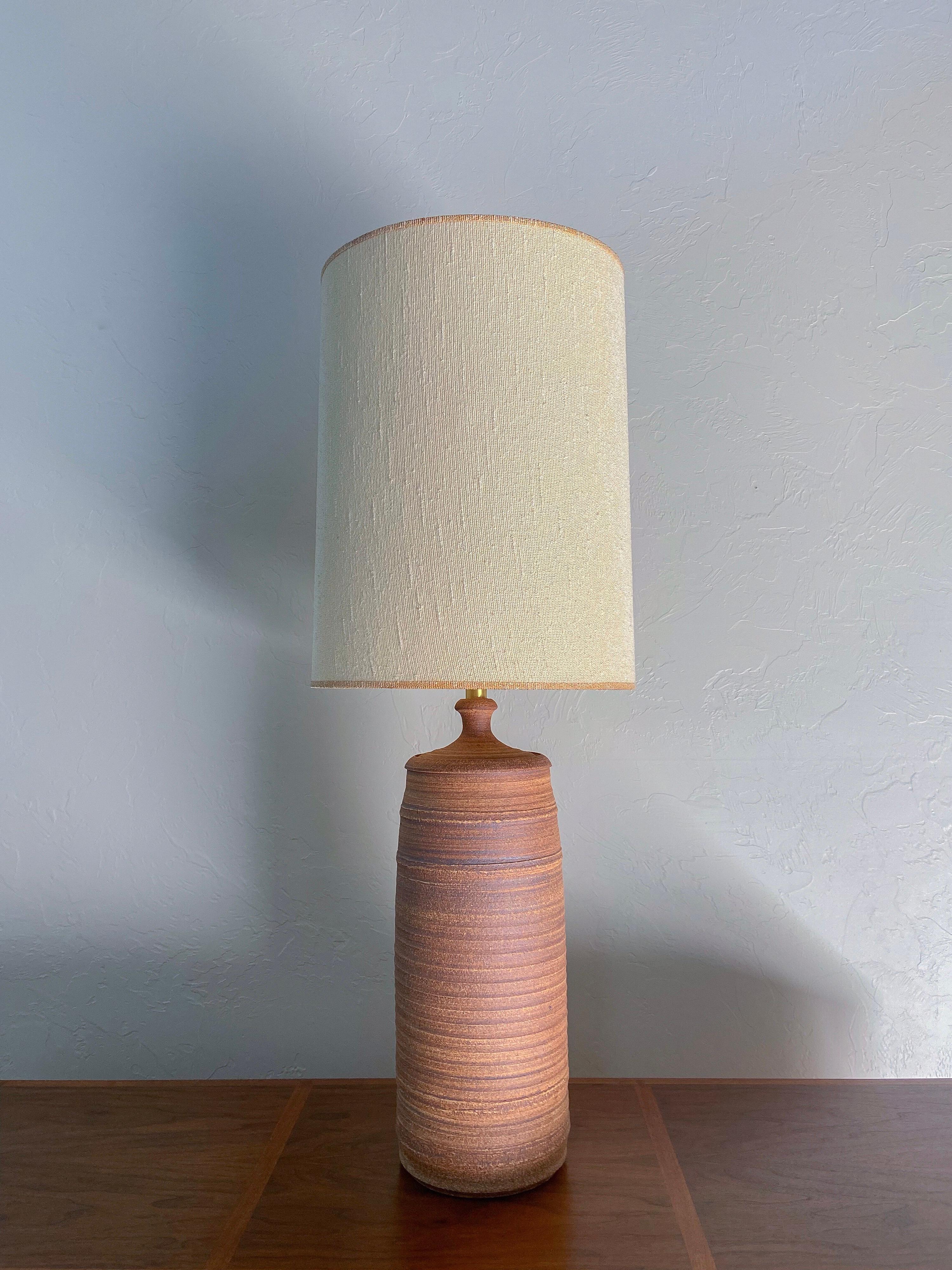 A large-scale hand made stoneware lamp by Phil Bartok for the Affiliated Craftsmen Studios company. 

Wonderful earth tones and textures lend this lamp to a variety of appropriate styles. 

Bartok was cofounder of Affiliated Ctaftsmen Studios with