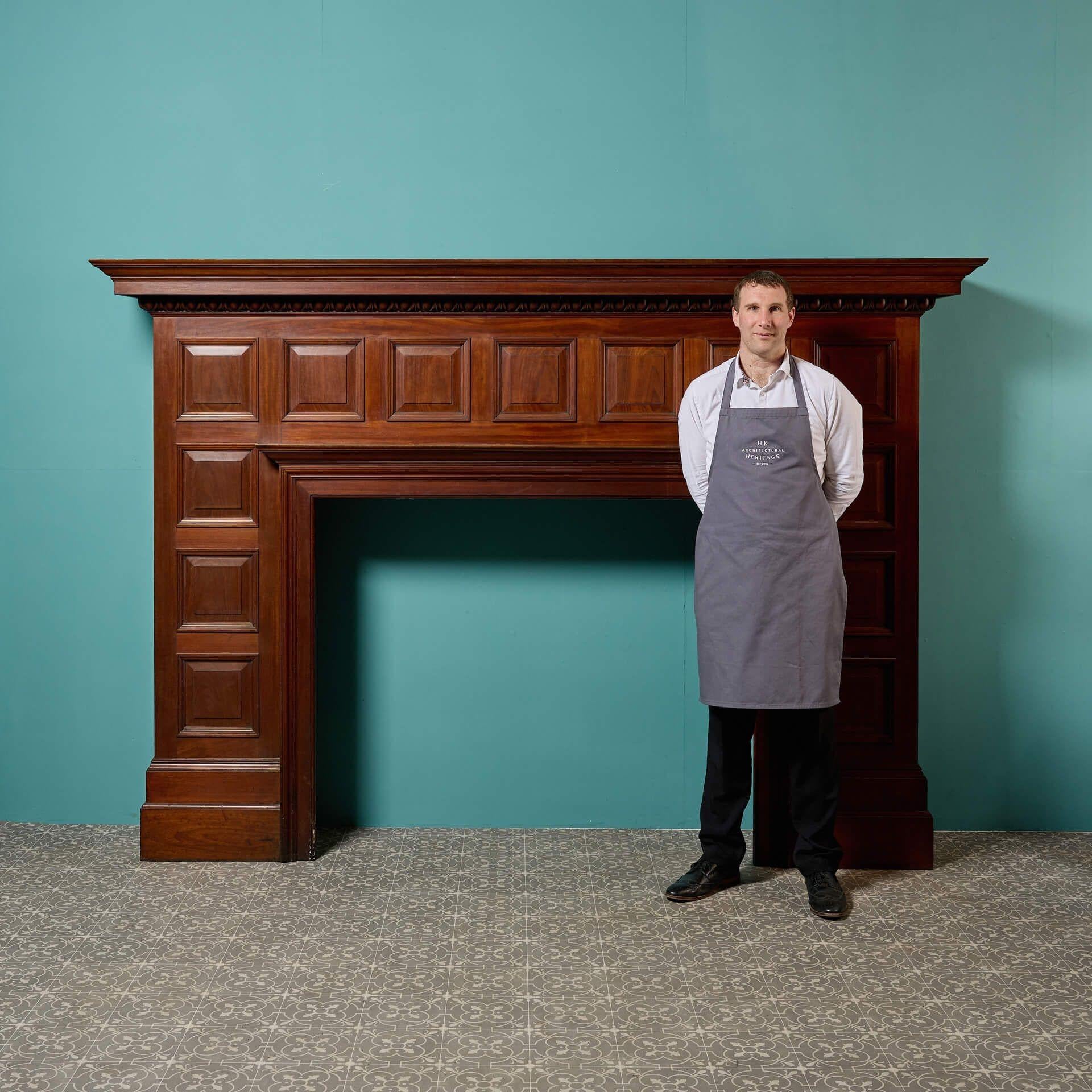 A very good quality, large scale Edwardian panelled mahogany fireplace with a handsome warm wood patina and excellent condition finish. Reclaimed from a large country house in Staffordshire.

Dating from the early 20th century Edwardian era, this