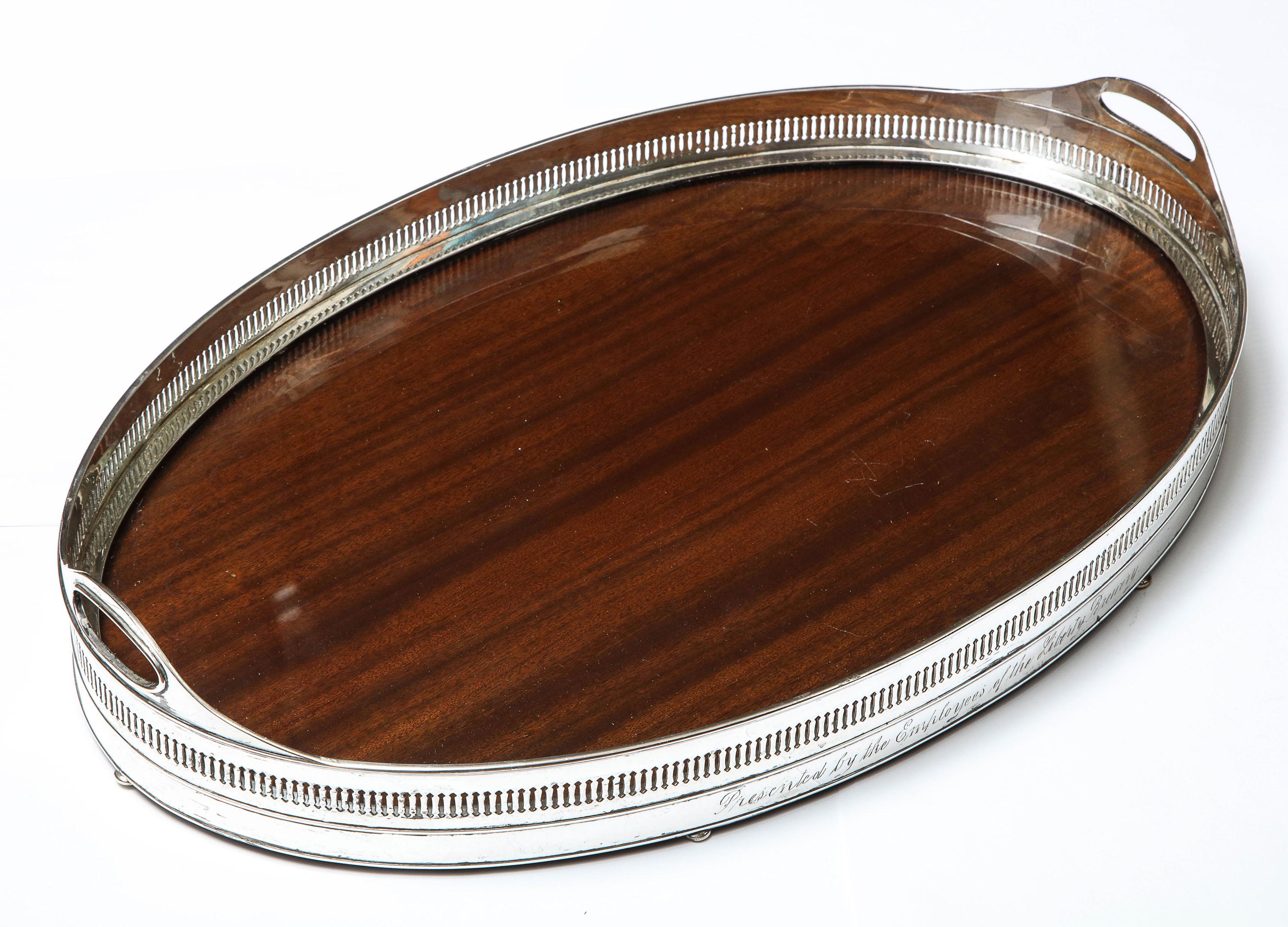 Large, Edwardian period, Sheffield silver plate - mounted wood gallery tray on bun feet, Wilcox Silver Plate Company, Meriden Connecticut, Ca. 1915. Measures 20 inches wide x 13 inches deep (at deepest point) x 4 inches high (to top of handles).