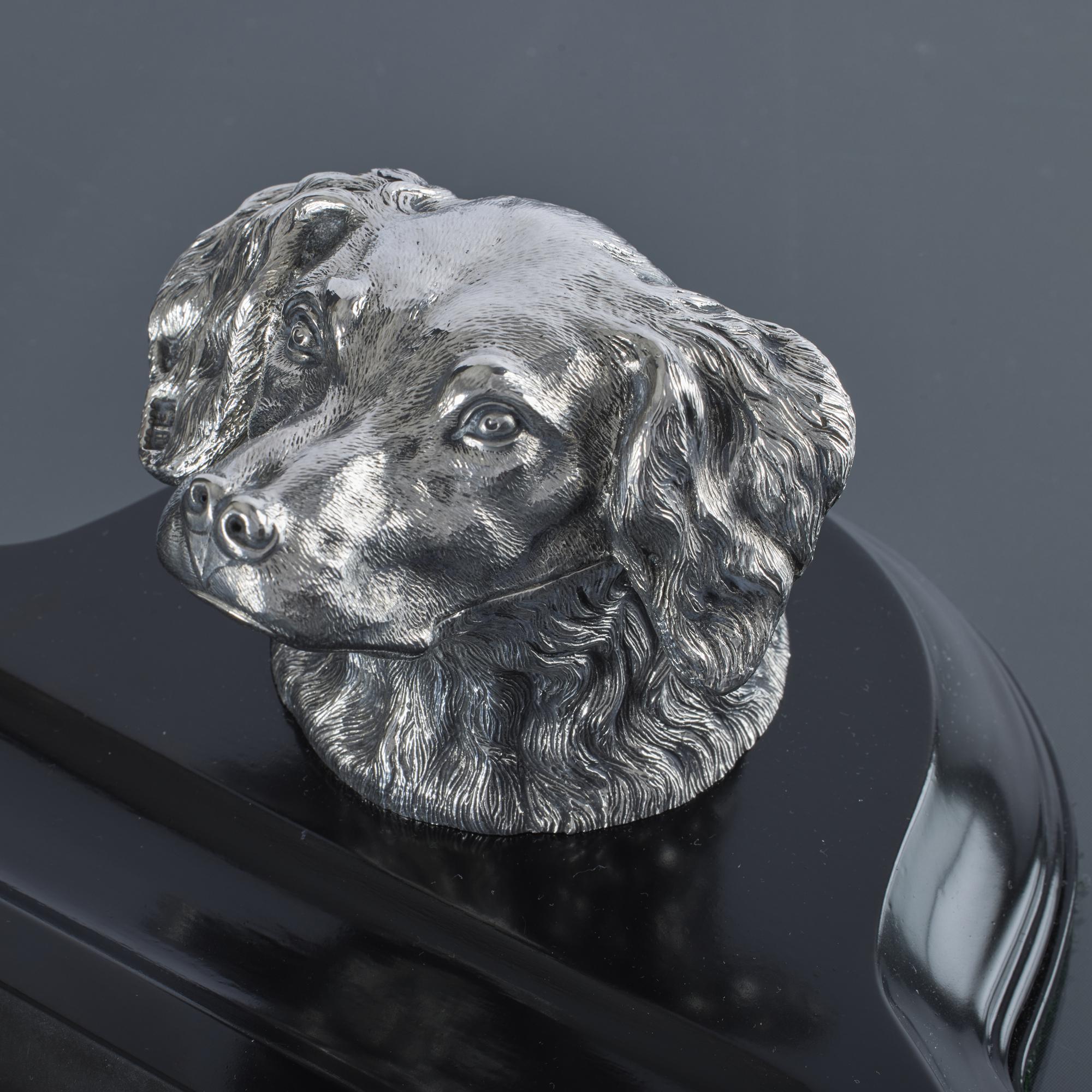 Wonderful antique silver cast and hand chased inkwell in the form of a hound. Beautifully modelled and fitted with a glass inkwell, it sits on its original carved and ebonised wooden base with pen rest groove.
 
 It is an exceptionally fine model