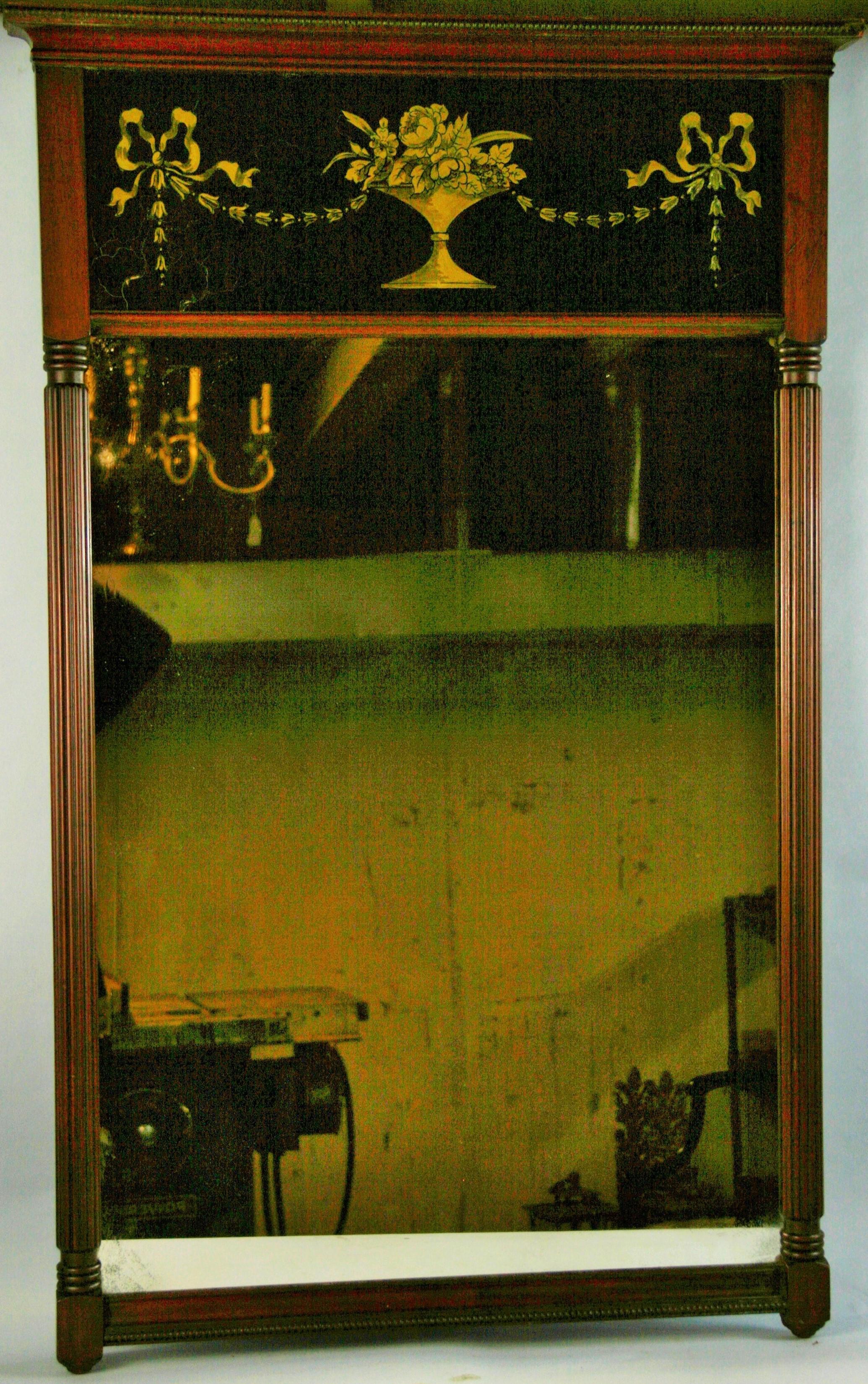 3-812 Large wood mirror with black and gold eglomise glass with fluted columns.