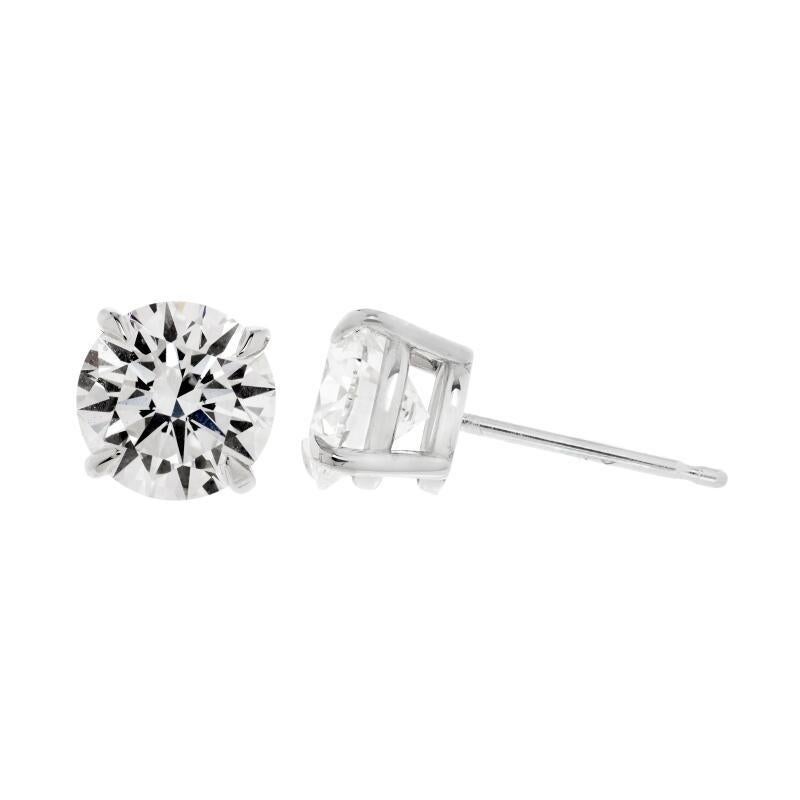 Large Eight Carats Each Lab-Created CZ Round Diamond Studs, crafted with our own lab-grown D-grade brilliant diamond-cut cubic zirconia, set in modern solid sterling silver settings.  Our jewels are made in our New York City atelier, priced