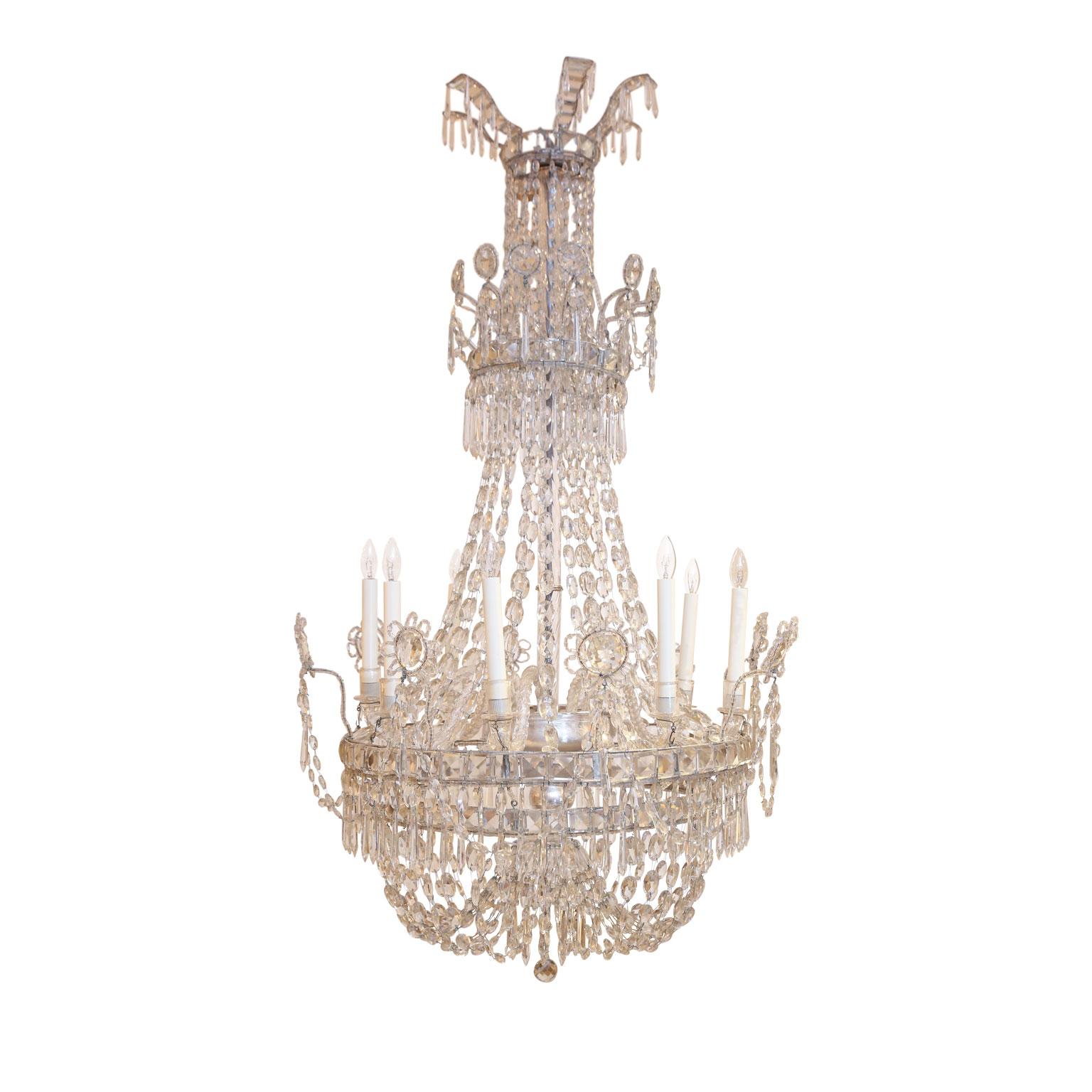 Large eight-light crystal chandelier from Italy, circa 1850-1860. Decorated in crystal prisms, beads and stunning crystal reflectors. Arms are hand blown Murano glass radiating from a glass enclosed silver-gilt metal body. Newly-wired for use within