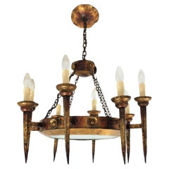 Grand lustre torch à huit branches en fer forgé doré, années 1940