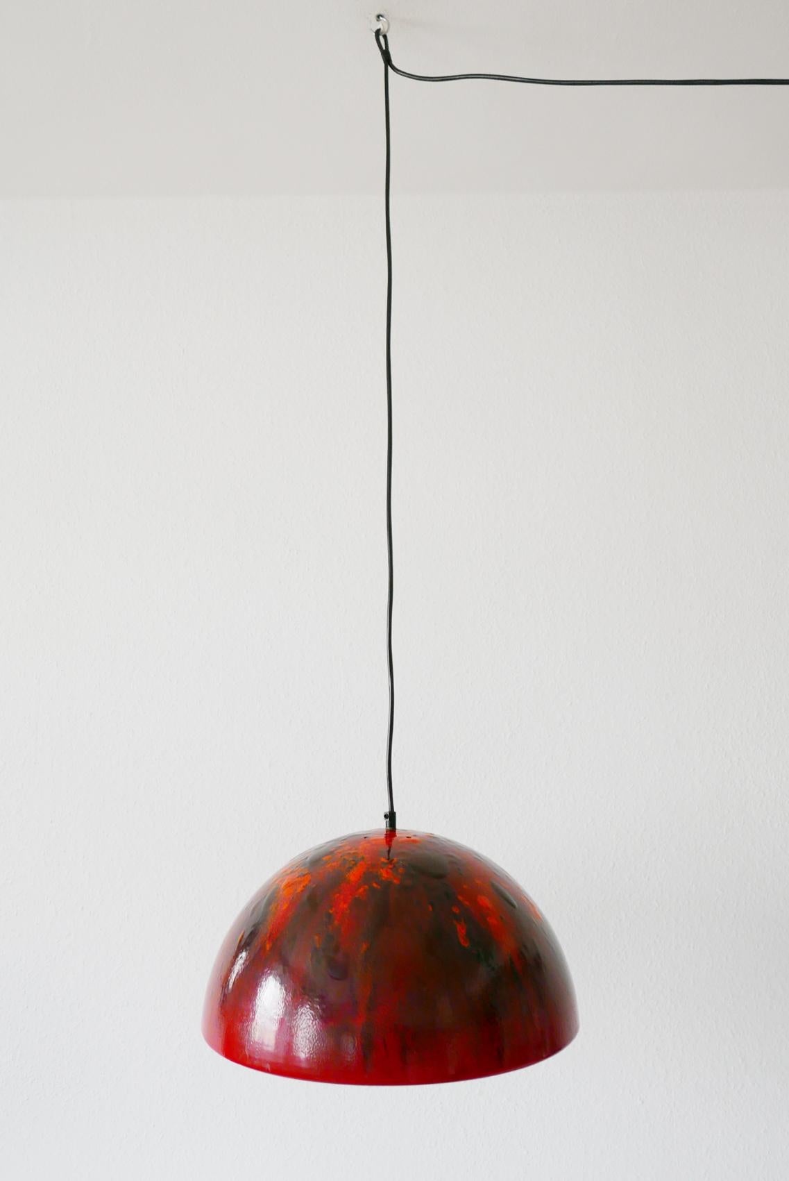Rare, large Mid-Century Modern pendant lamp. Designed and manufactured probably in 1960s, Denmark.

Executed in outside red, orange, inside white enameled metal. The lamp needs one E27 Edison screw fit bulb, is wired. It runs both on 110 / 230 Volt.